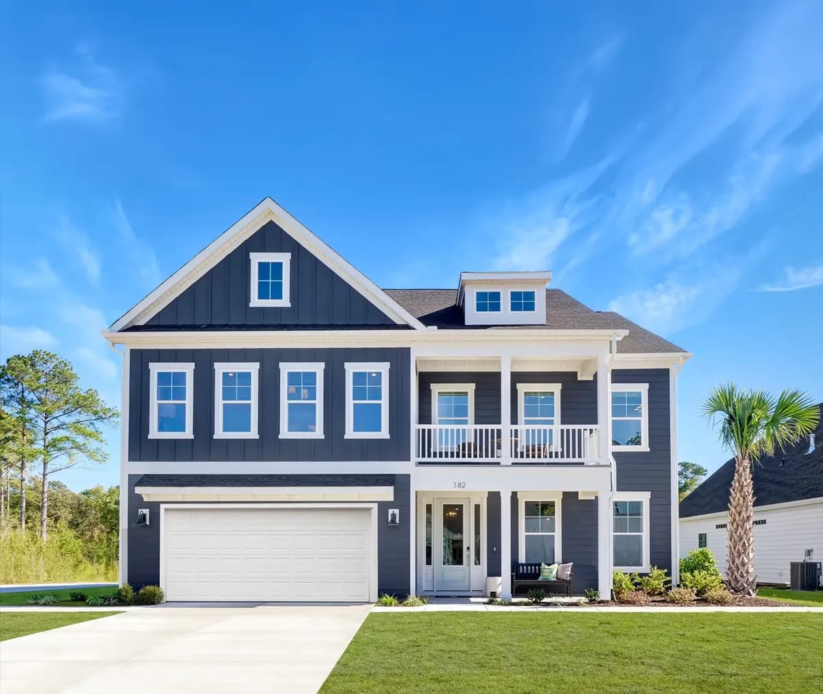 Blue and white exterior new construction two-story homes built by Mungo Homes, a Clayton company.