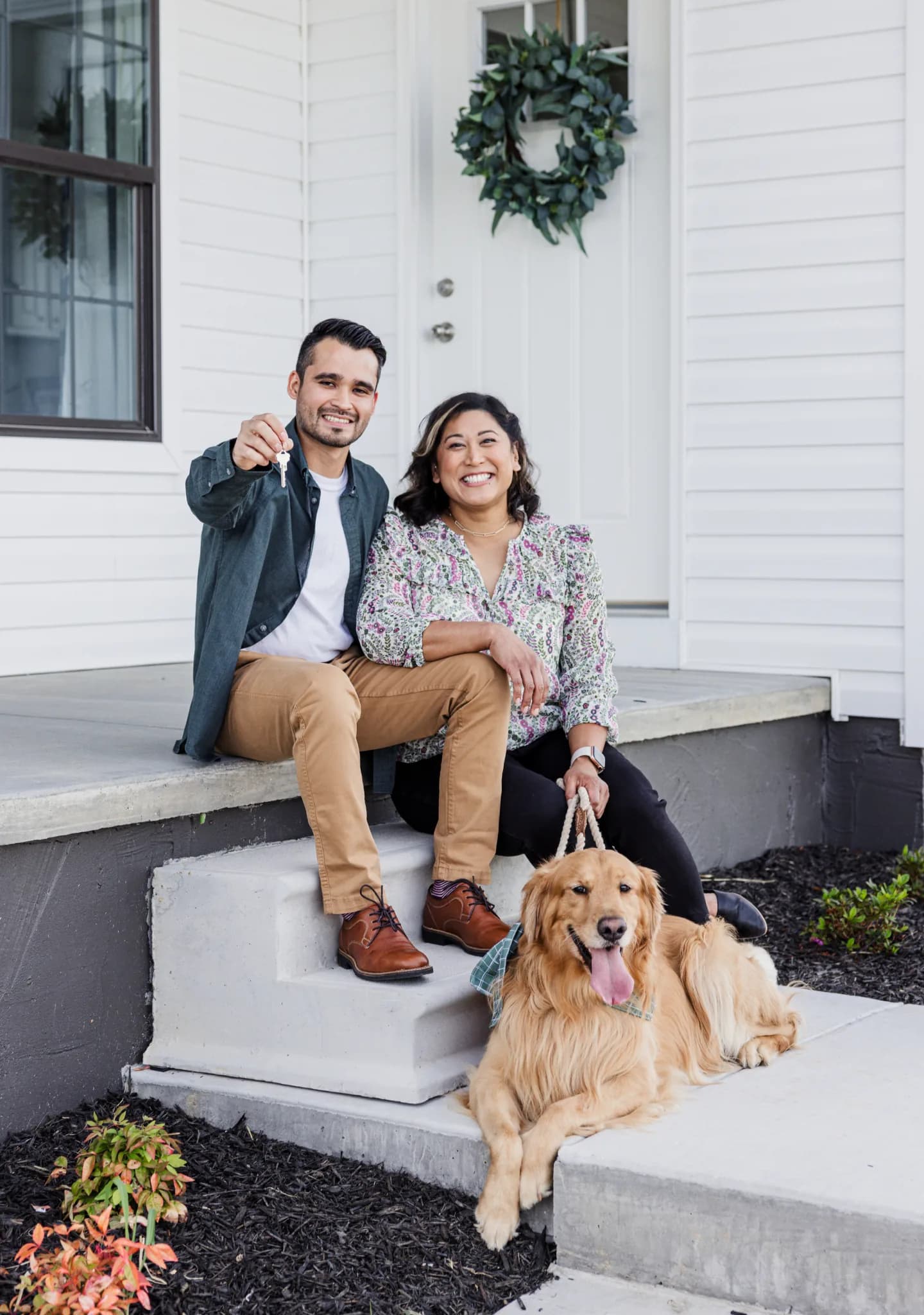 Family on the porch of their new home