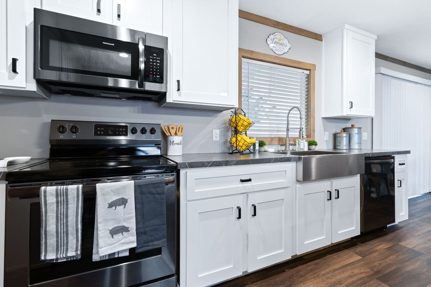 The FARMHOUSE 3 Kitchen. This Manufactured Mobile Home features 3 bedrooms and 2 baths.