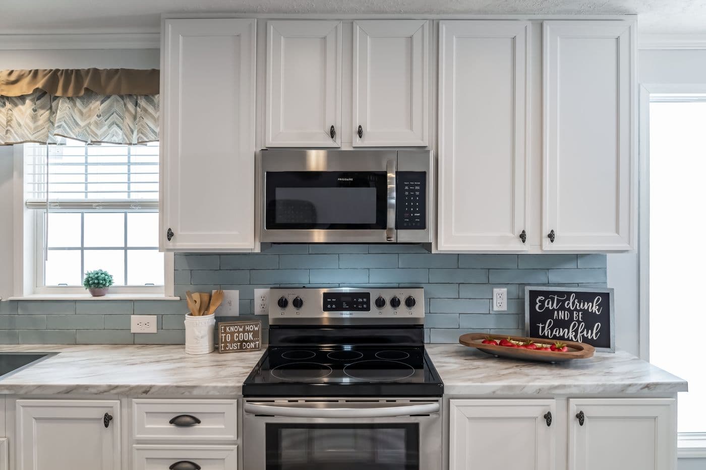 The THE LEAHY Kitchen. This Manufactured Mobile Home features 4 bedrooms and 2 baths.