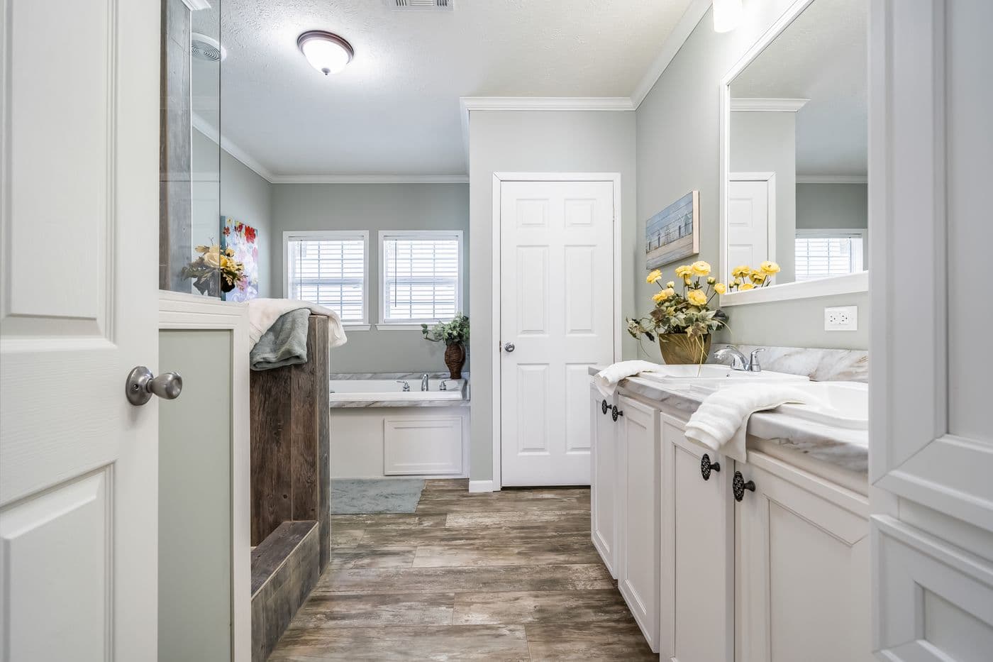 The THE INGRAM Primary Bathroom. This Manufactured Mobile Home features 3 bedrooms and 2 baths.