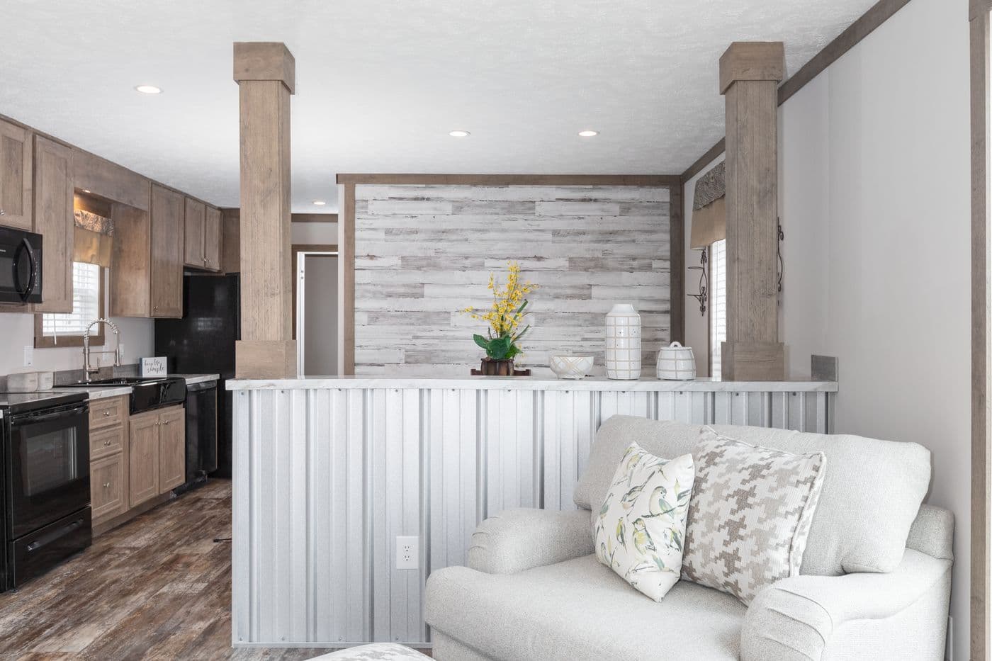 The THE WALSH Living Room. This Manufactured Mobile Home features 3 bedrooms and 2 baths.