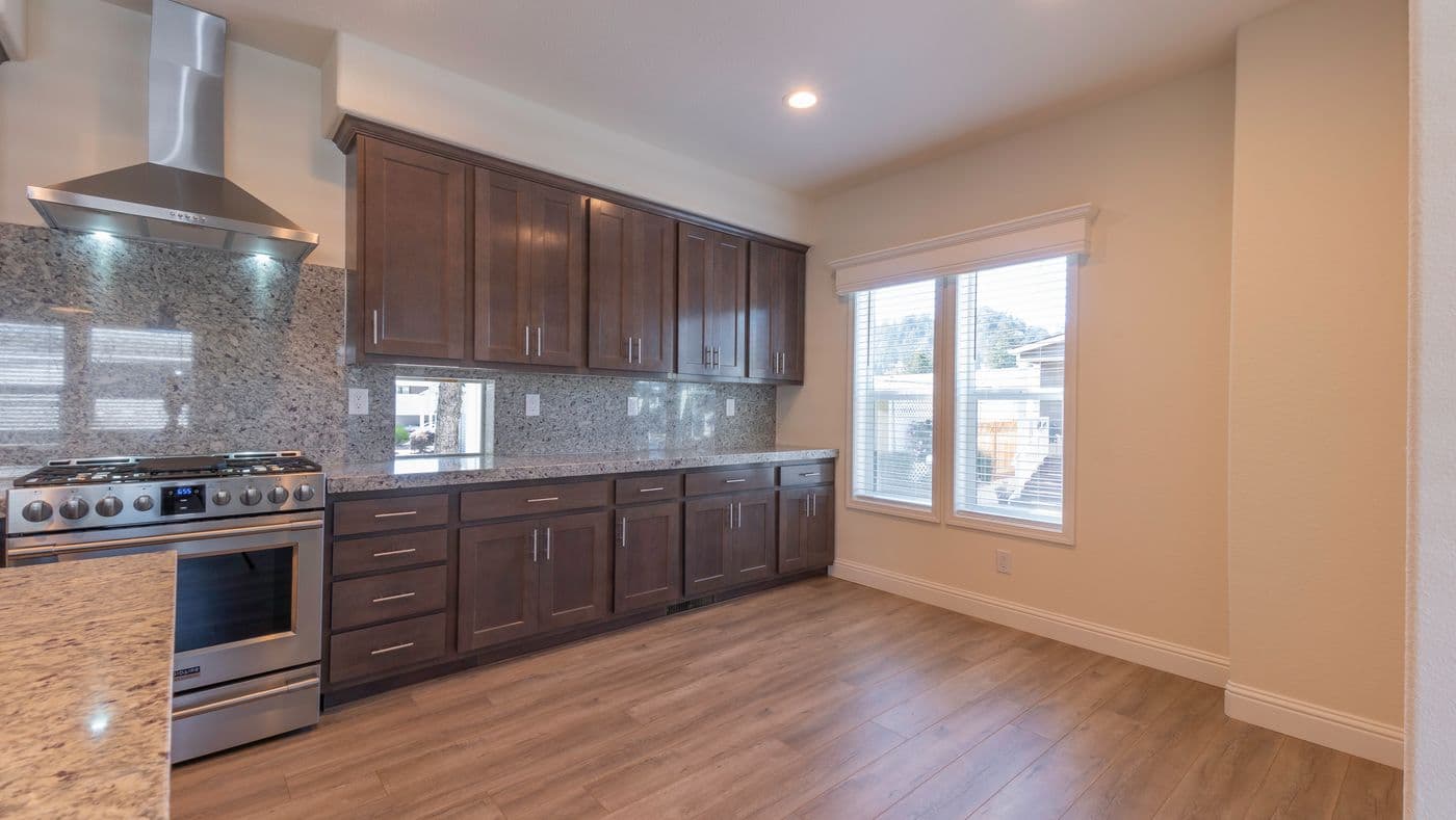 The CORONADO 2456B Kitchen. This Manufactured Mobile Home features 3 bedrooms and 2 baths.