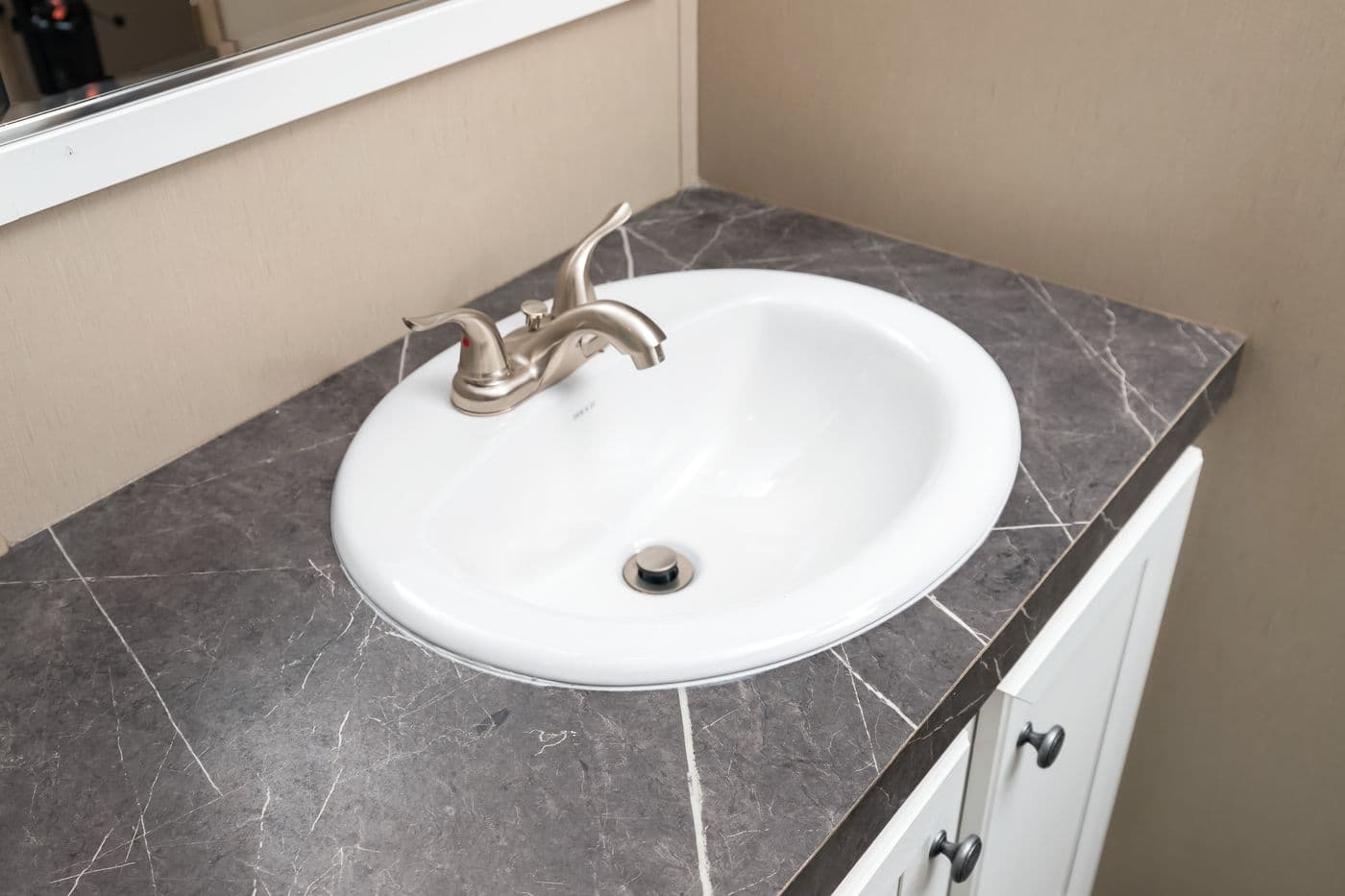 The FARMHOUSE FLEX Guest Bathroom. This Manufactured Mobile Home features 3 bedrooms and 2.5 baths.