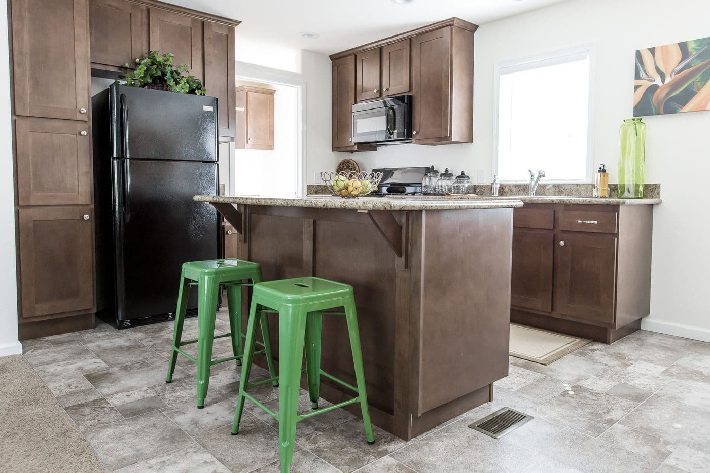 The FAIRPOINT 24463A Kitchen. This Manufactured Mobile Home features 3 bedrooms and 2 baths.