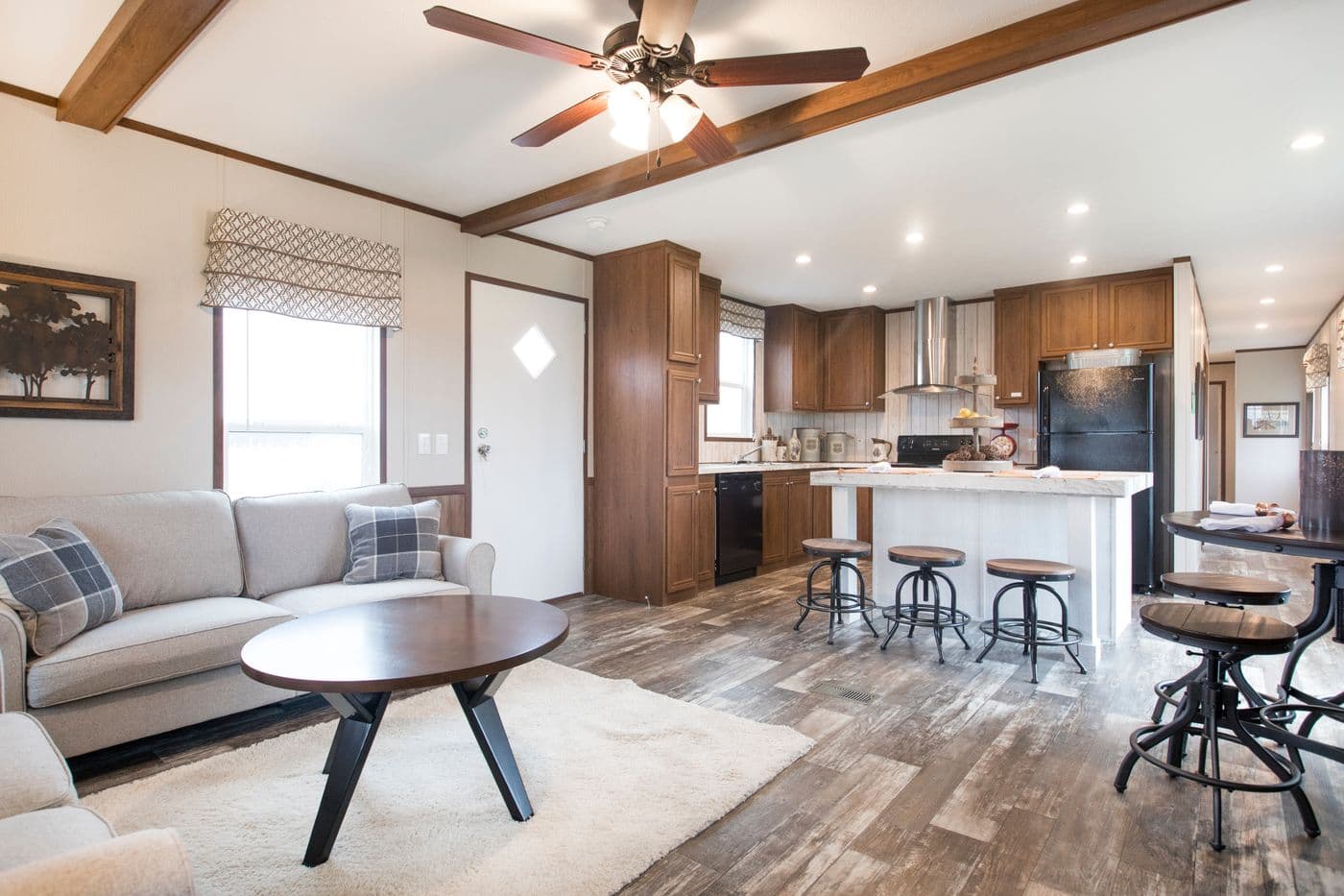 The THE LODGE Living Room. This Manufactured Mobile Home features 2 bedrooms and 2 baths.