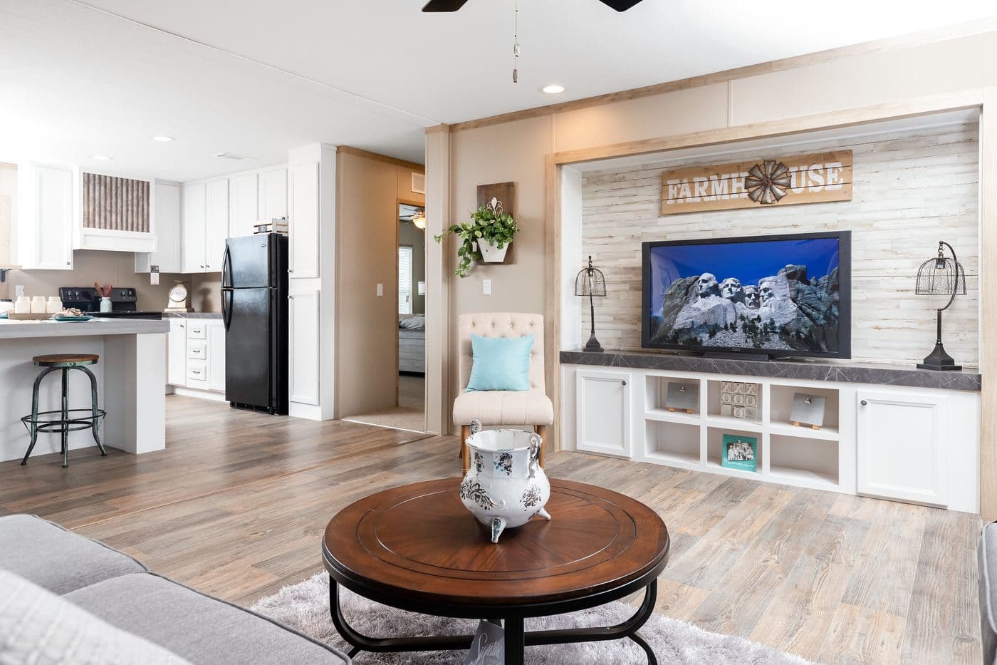 The FARMHOUSE FLEX Living Room. This Manufactured Mobile Home features 3 bedrooms and 2.5 baths.