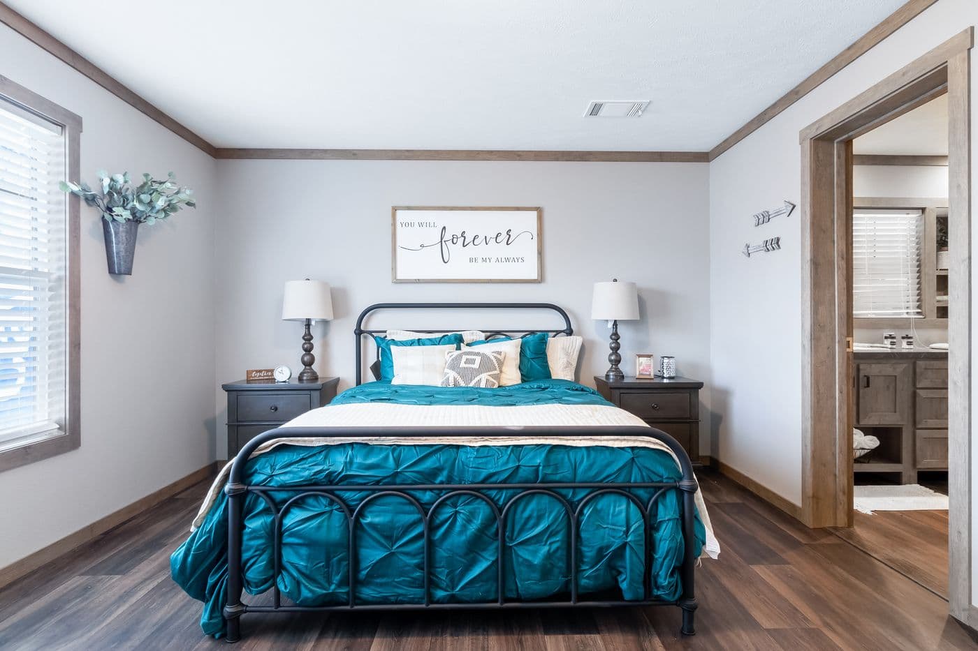 The FARMHOUSE 3 Primary Bedroom. This Manufactured Mobile Home features 3 bedrooms and 2 baths.