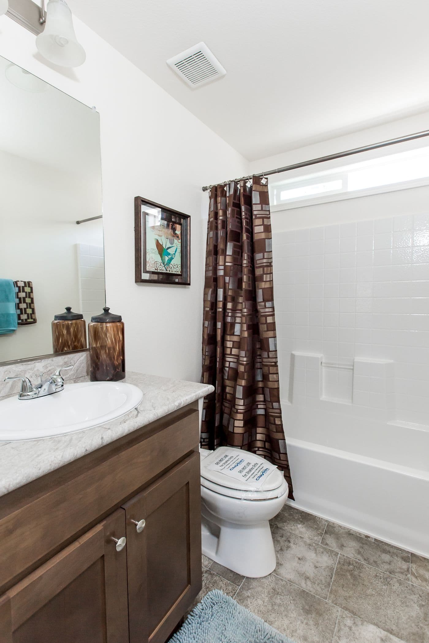 The FAIRPOINT 24463A Guest Bathroom. This Manufactured Mobile Home features 3 bedrooms and 2 baths.
