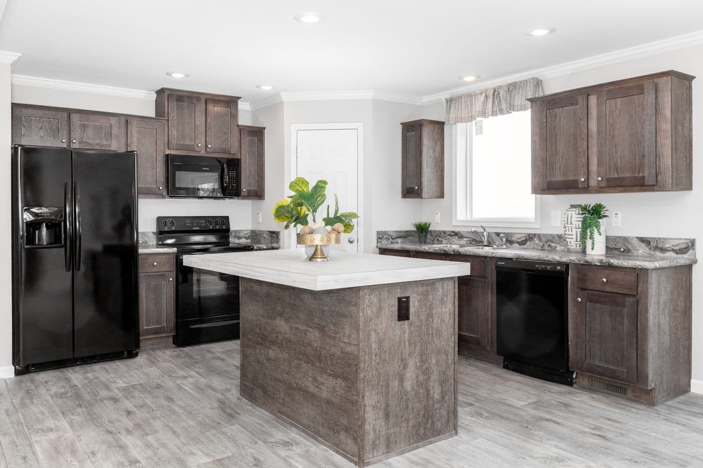 The THE VILLETTE Kitchen. This Manufactured Mobile Home features 3 bedrooms and 2 baths.