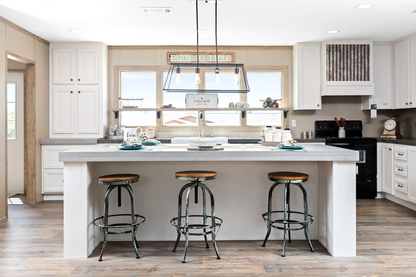 The FARMHOUSE FLEX Kitchen. This Manufactured Mobile Home features 3 bedrooms and 2.5 baths.