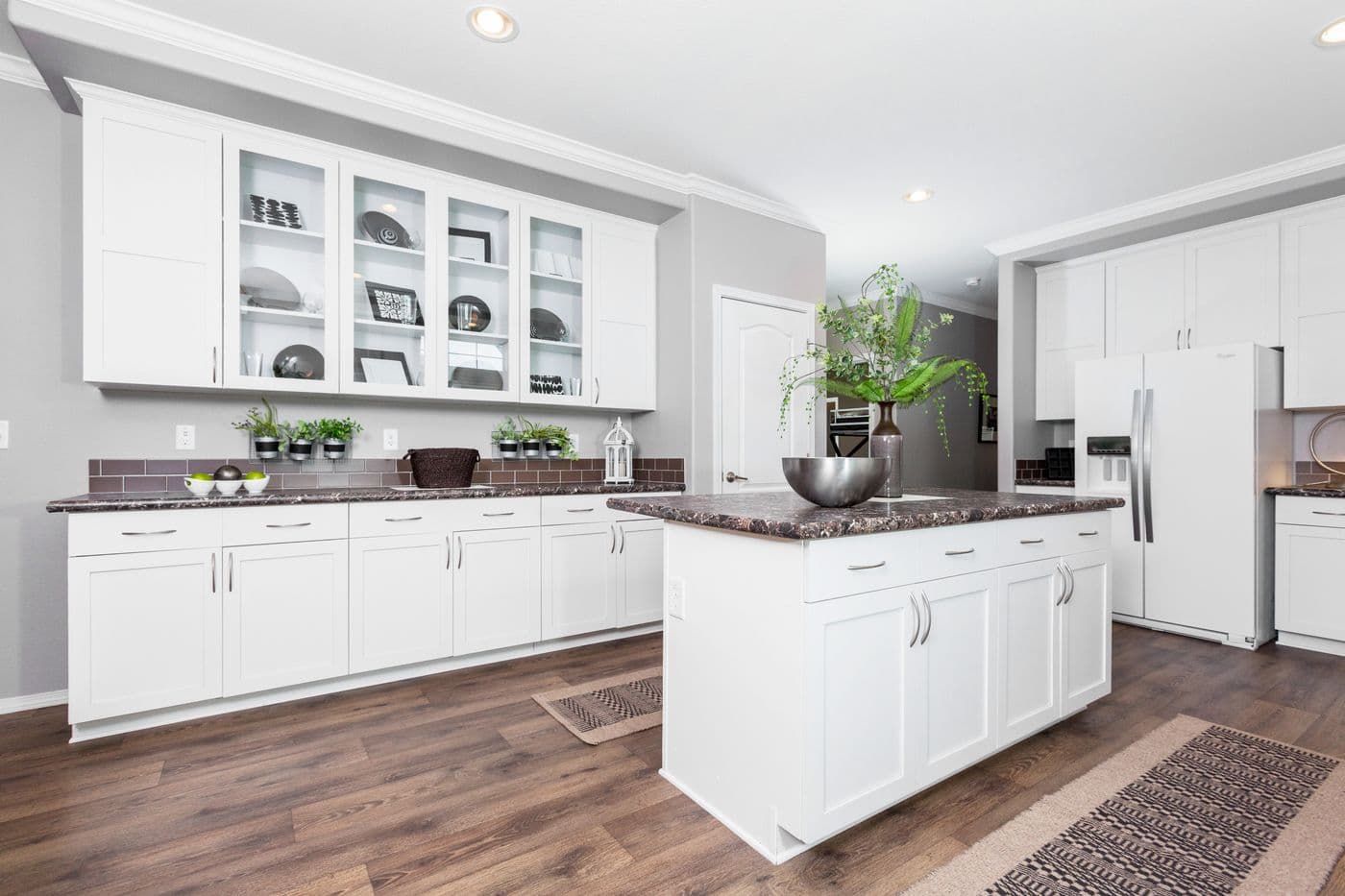 The ENCHANTMENT 3070A Kitchen. This Manufactured Mobile Home features 3 bedrooms and 2 baths.