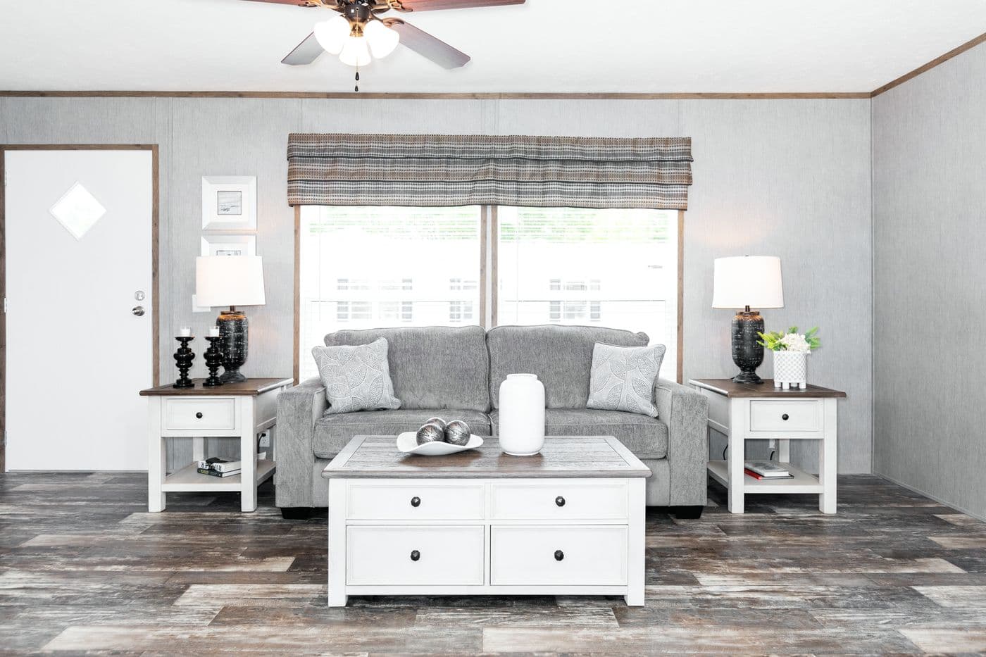 The THE MORRIS Living Room. This Manufactured Mobile Home features 3 bedrooms and 2 baths.
