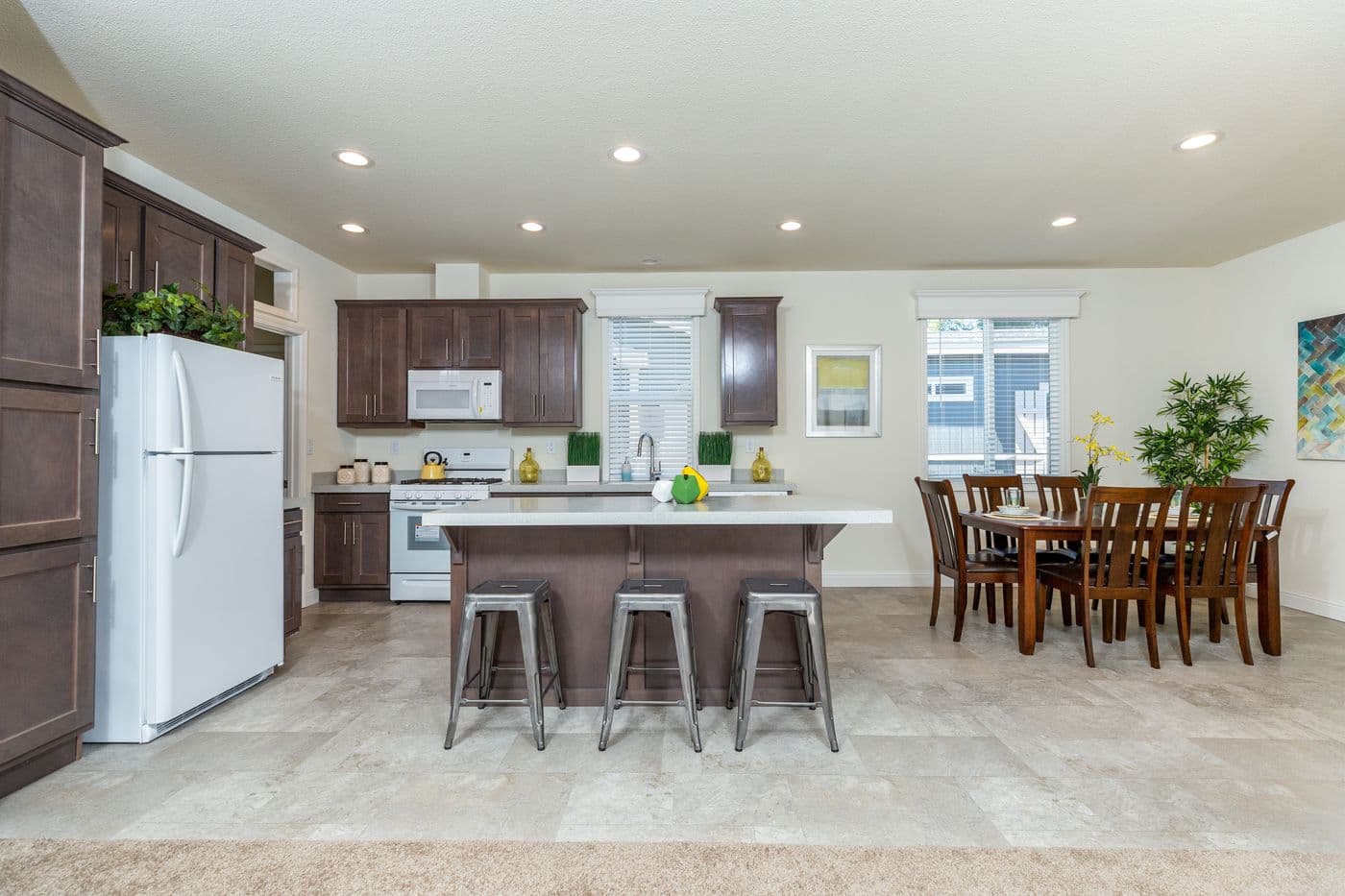 The FAIRPOINT 24564A Dining Area. This Manufactured Mobile Home features 4 bedrooms and 2 baths.