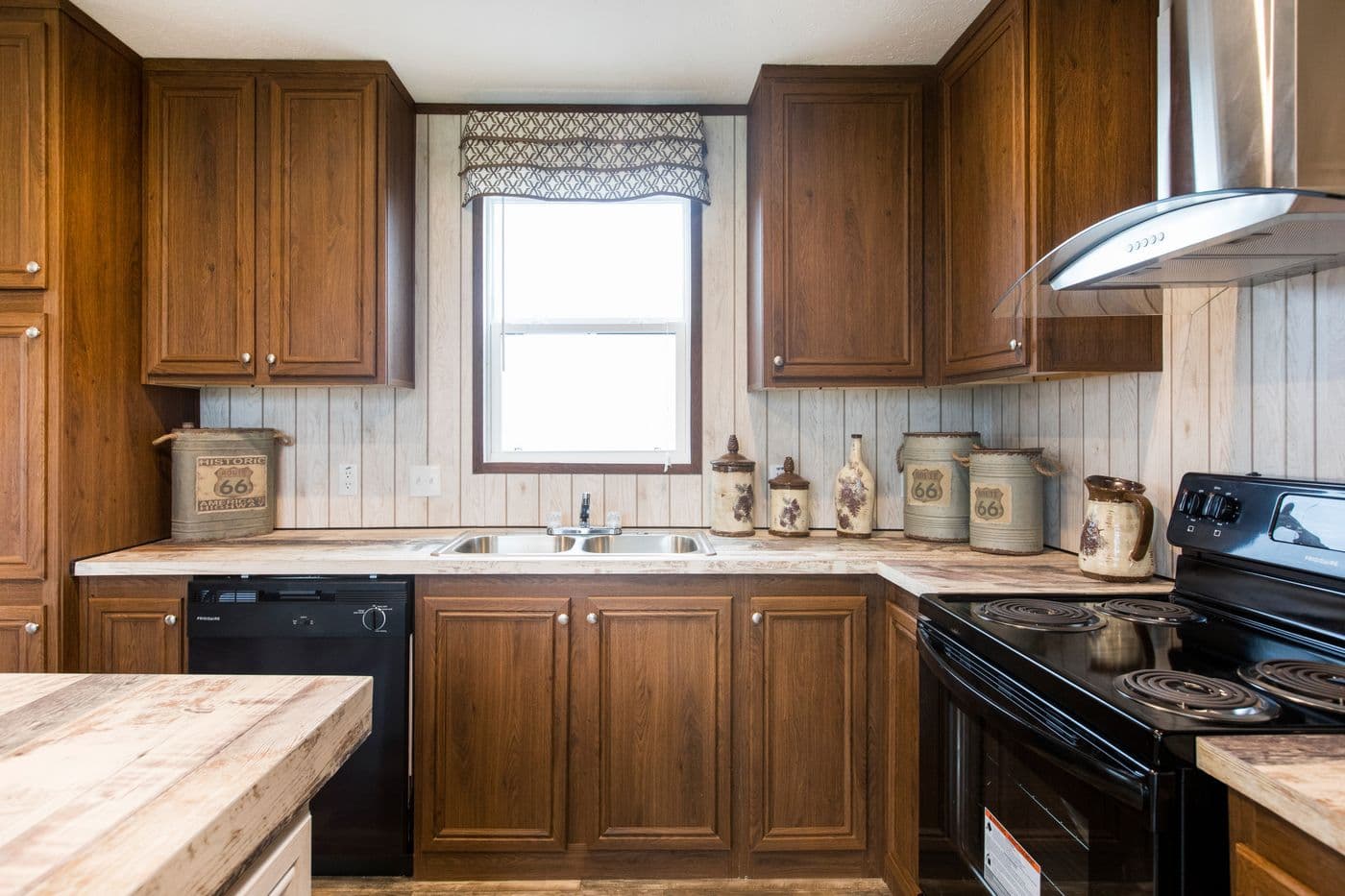 The THE LODGE Kitchen. This Manufactured Mobile Home features 2 bedrooms and 2 baths.