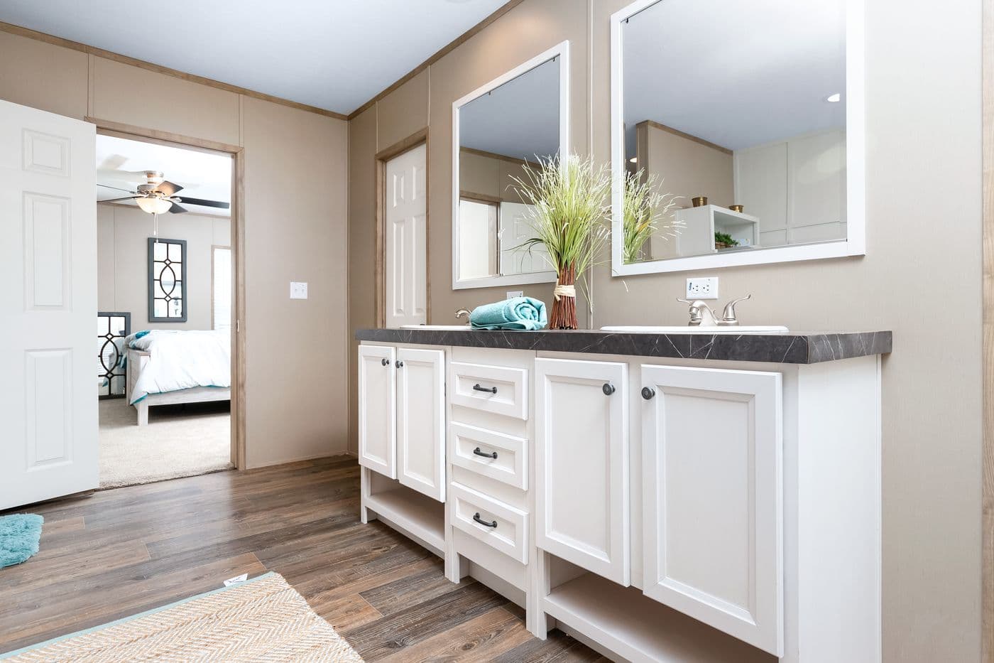 The FARMHOUSE FLEX Primary Bathroom. This Manufactured Mobile Home features 3 bedrooms and 2.5 baths.