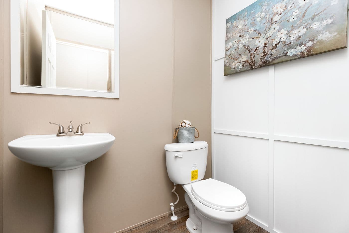 The FARMHOUSE FLEX Guest Bathroom. This Manufactured Mobile Home features 3 bedrooms and 2.5 baths.