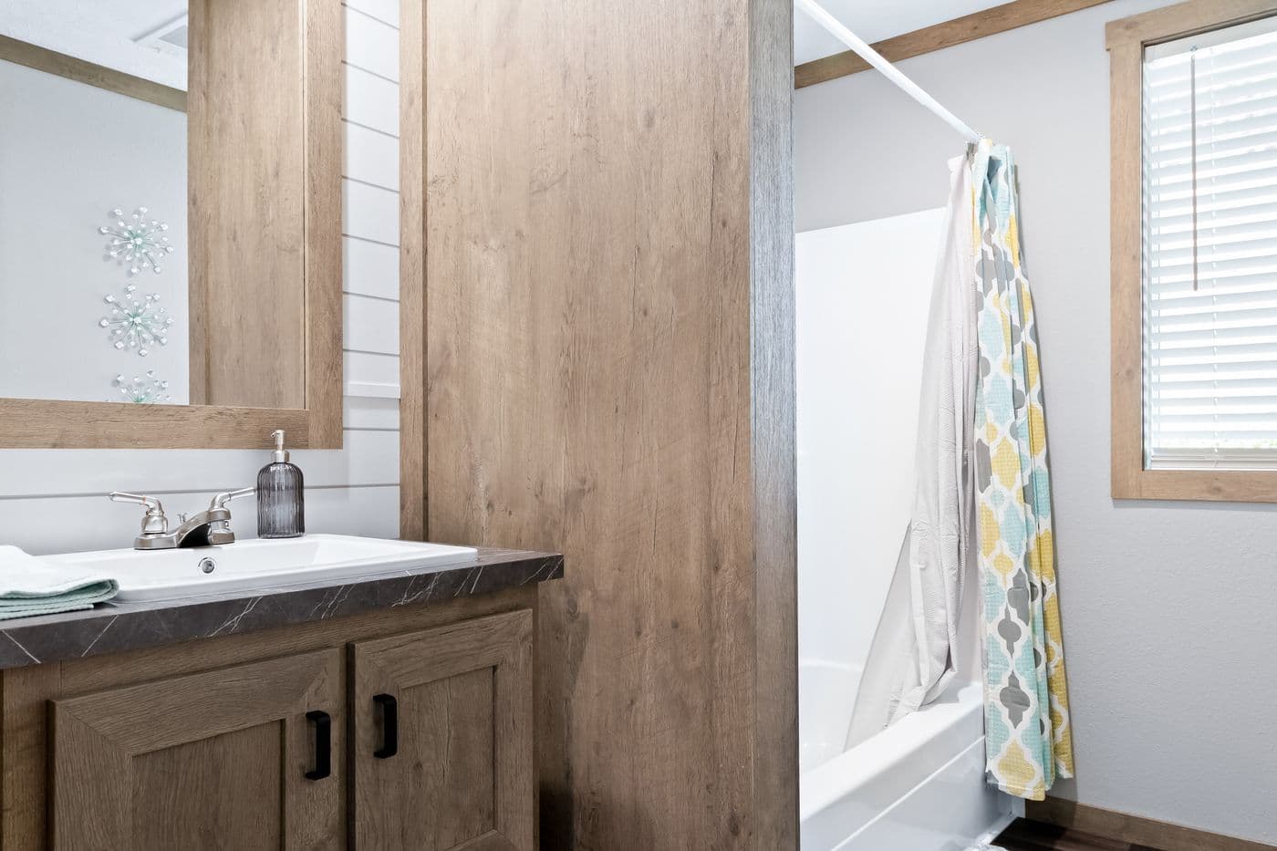 The FARMHOUSE 3 Guest Bathroom. This Manufactured Mobile Home features 3 bedrooms and 2 baths.