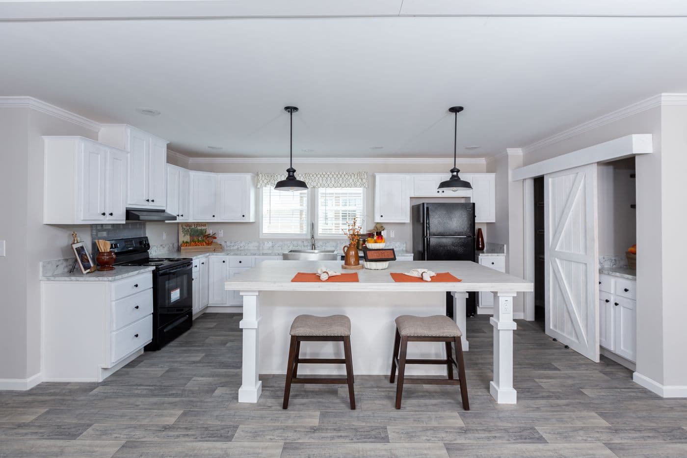 The THE FREEDOM BREEZE Kitchen. This Manufactured Mobile Home features 3 bedrooms and 2 baths.