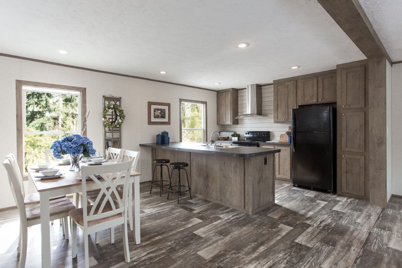 The THE BREEZE 2.5 Dining Area. This Manufactured Mobile Home features 4 bedrooms and 2 baths.