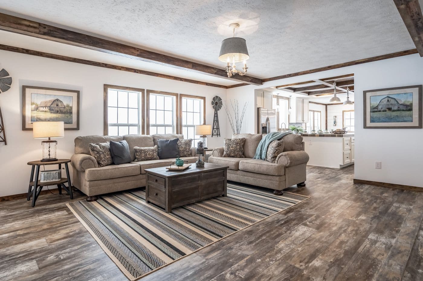 The THE EMMA JEAN Living Room. This Manufactured Mobile Home features 4 bedrooms and 3 baths.