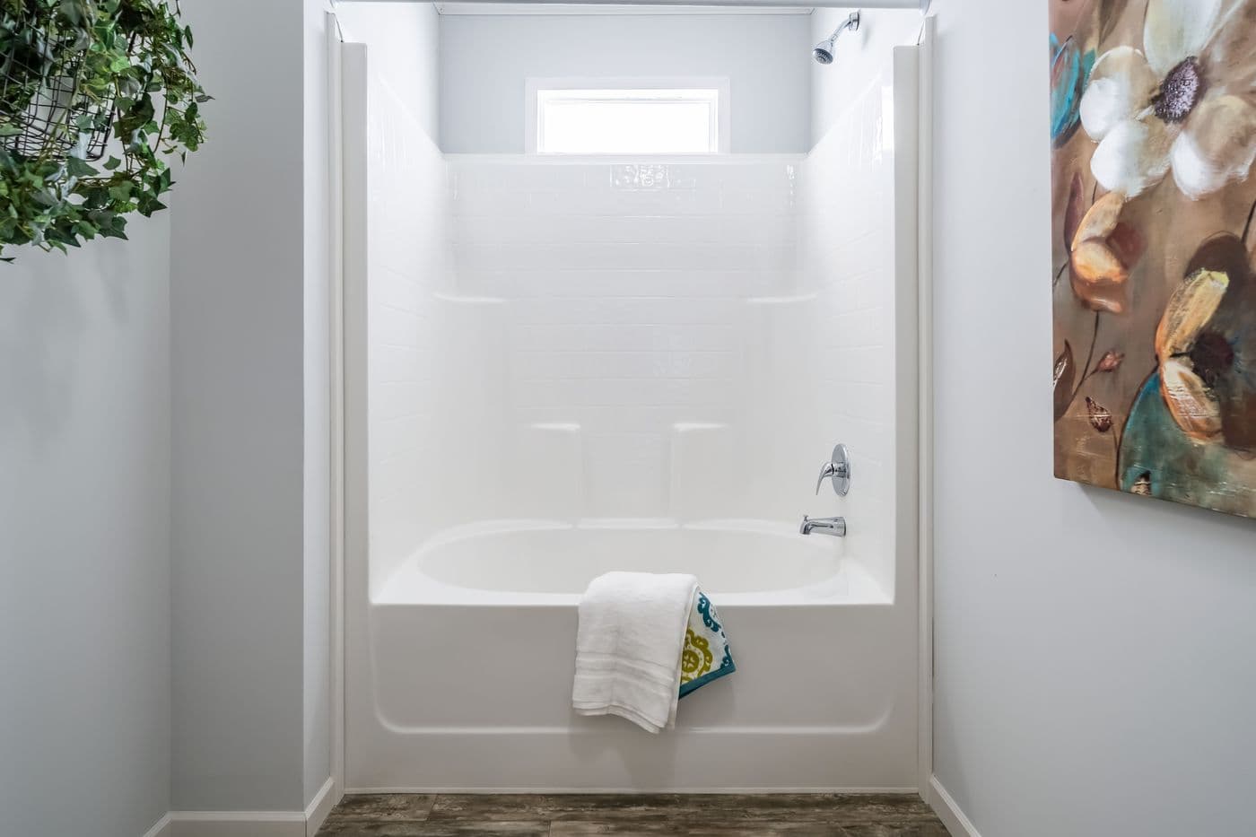 The THE INGRAM Guest Bathroom. This Manufactured Mobile Home features 3 bedrooms and 2 baths.