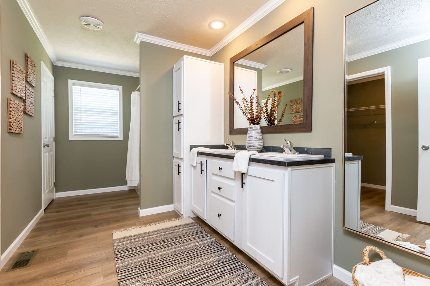 The KEENELAND Primary Bathroom. This Manufactured Mobile Home features 3 bedrooms and 2 baths.