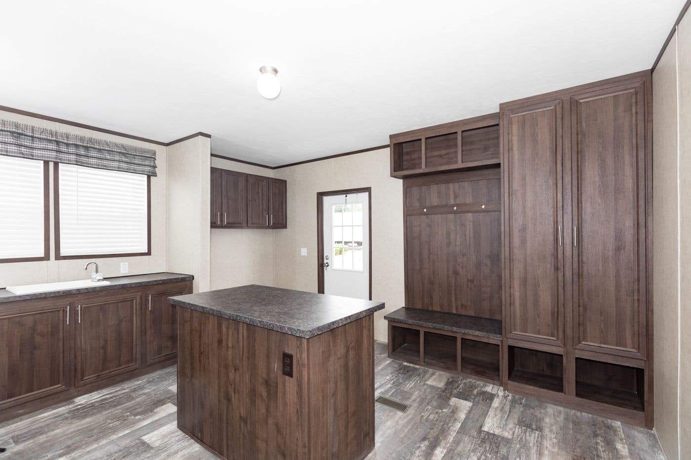 The THE RIVERWAY Utility Room. This Manufactured Mobile Home features 4 bedrooms and 2 baths.