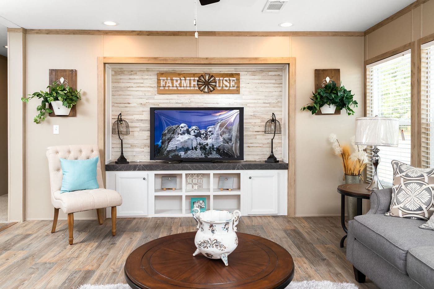 The FARMHOUSE FLEX Living Room. This Manufactured Mobile Home features 3 bedrooms and 2.5 baths.