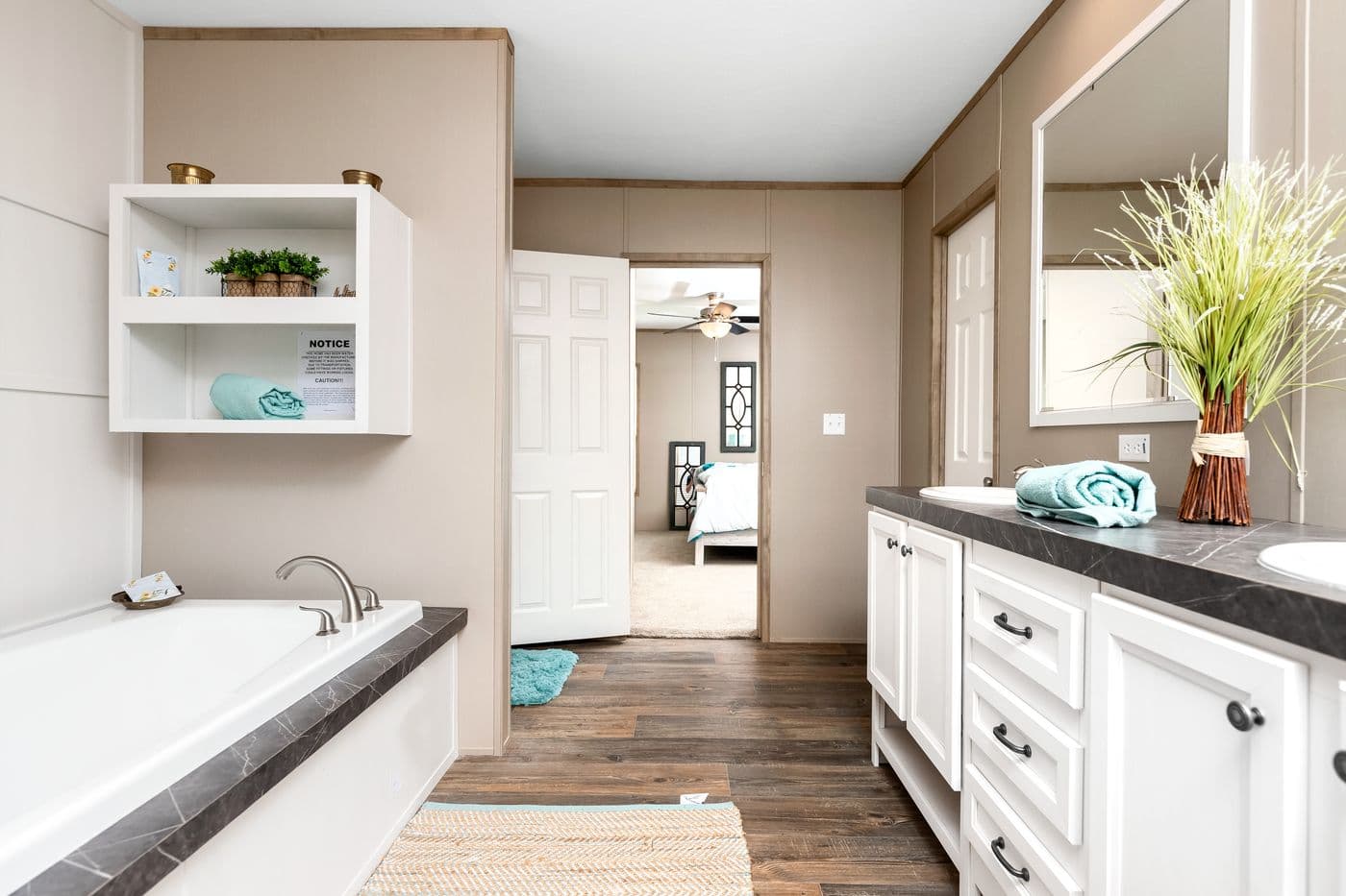 The FARMHOUSE FLEX Primary Bathroom. This Manufactured Mobile Home features 3 bedrooms and 2.5 baths.
