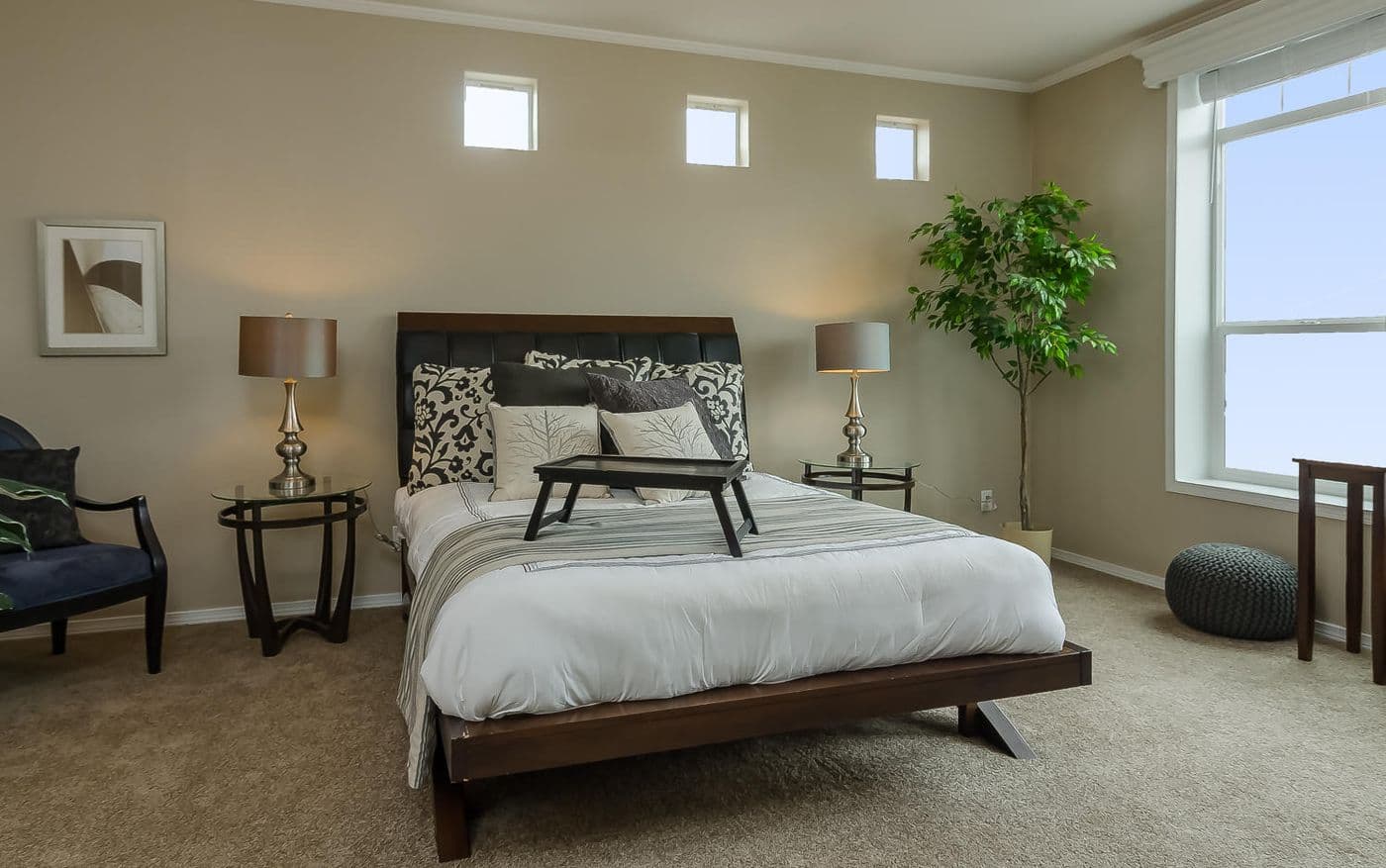 The TRANQUILITY TR3062A Primary Bedroom. This Manufactured Mobile Home features 3 bedrooms and 2 baths.
