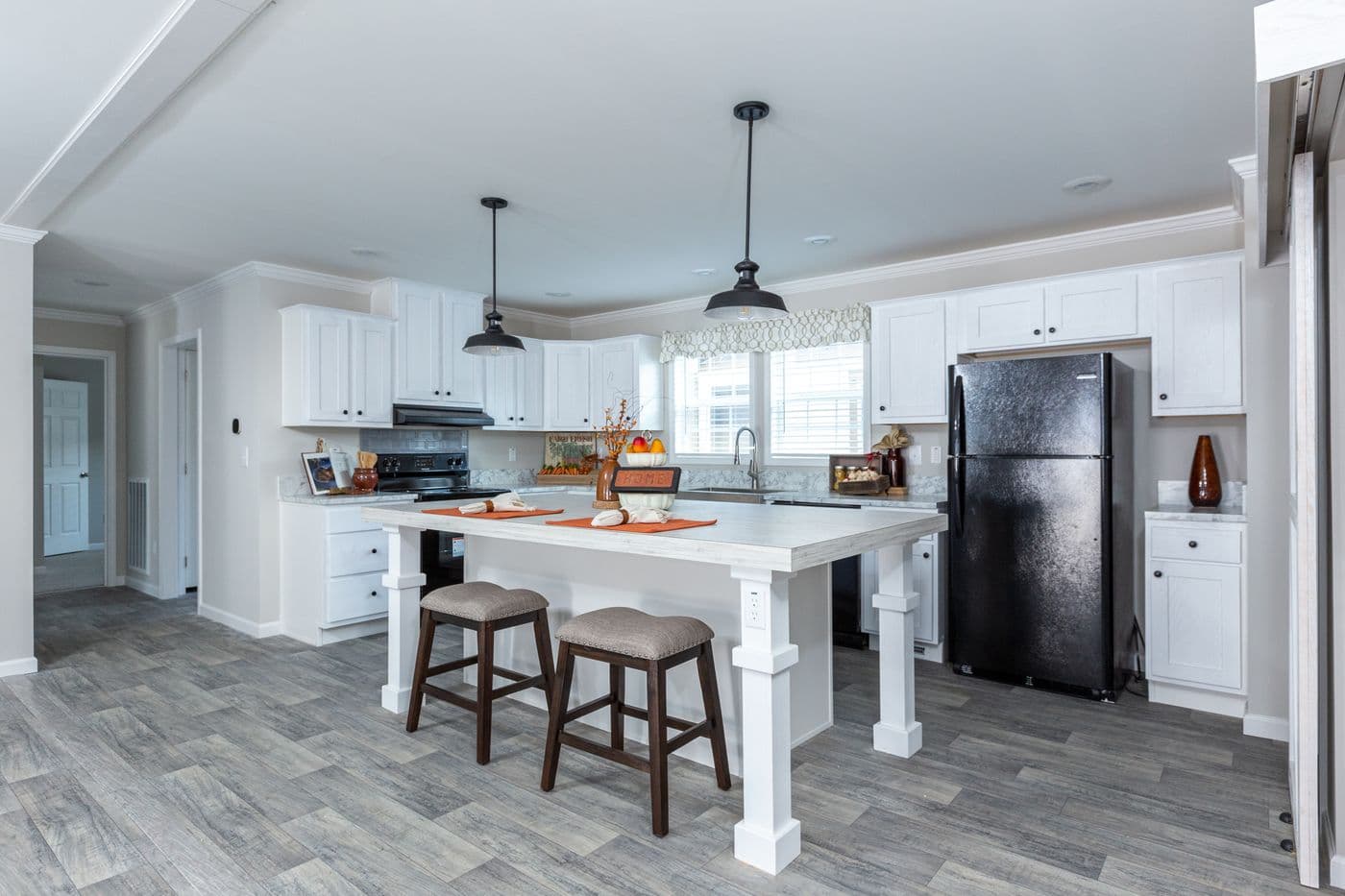 The THE FREEDOM BREEZE Kitchen. This Manufactured Mobile Home features 3 bedrooms and 2 baths.