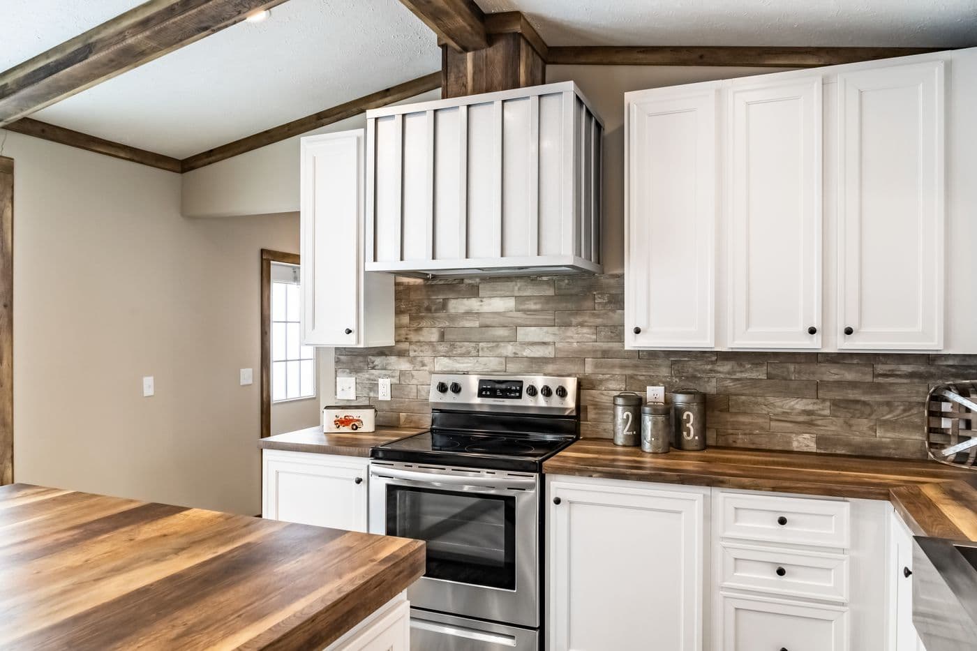 The THE BOBBY JO Kitchen. This Manufactured Mobile Home features 3 bedrooms and 2 baths.