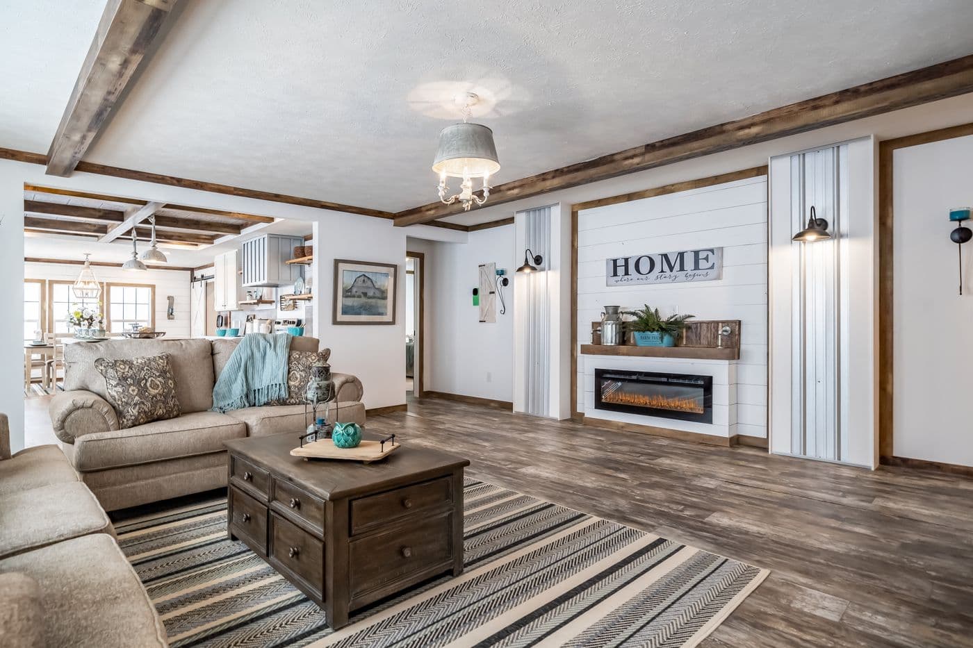 The THE EMMA JEAN Living Room. This Manufactured Mobile Home features 4 bedrooms and 3 baths.