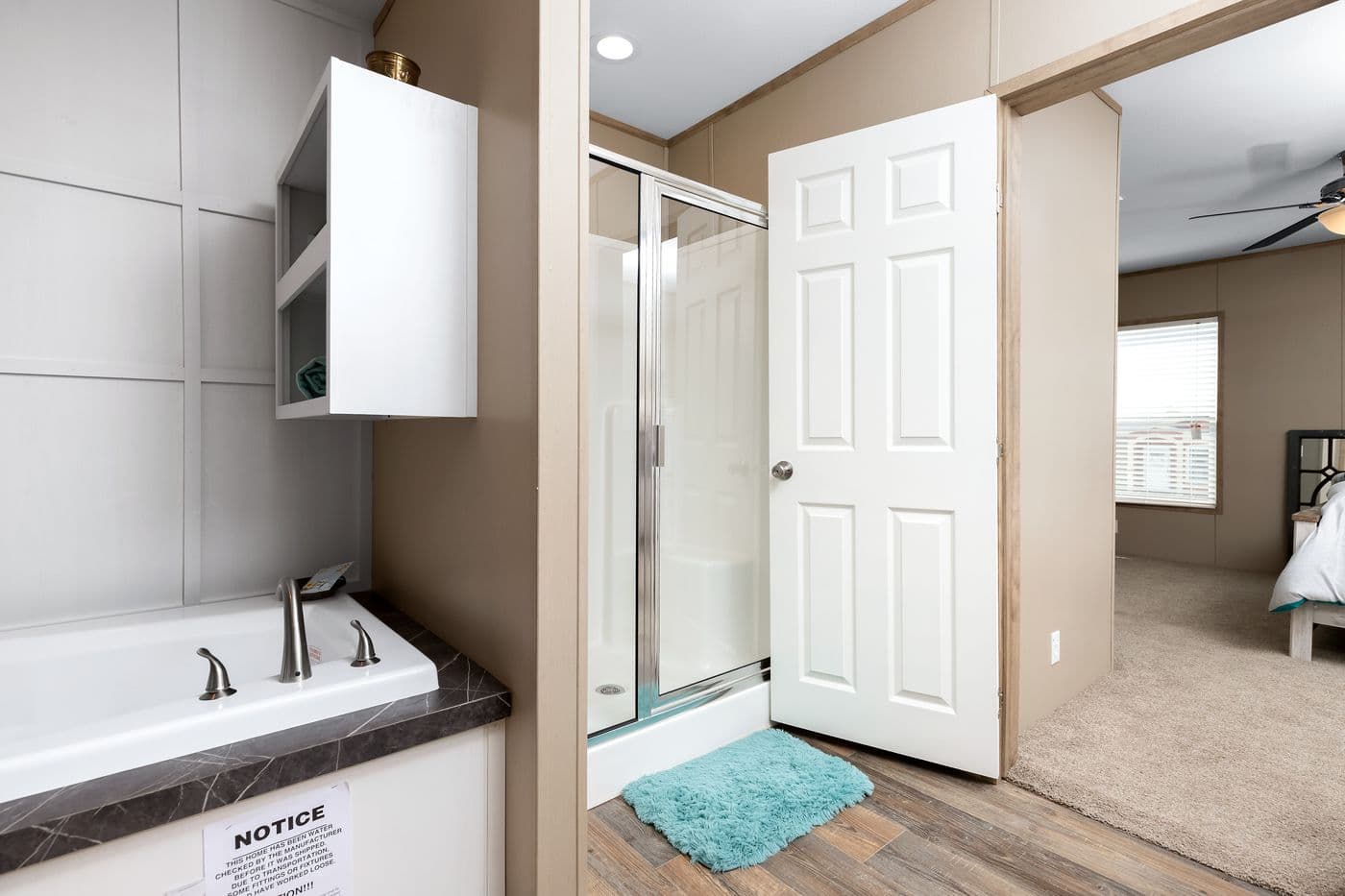 The FARMHOUSE FLEX Primary Bathroom. This Manufactured Mobile Home features 3 bedrooms and 2.5 baths.