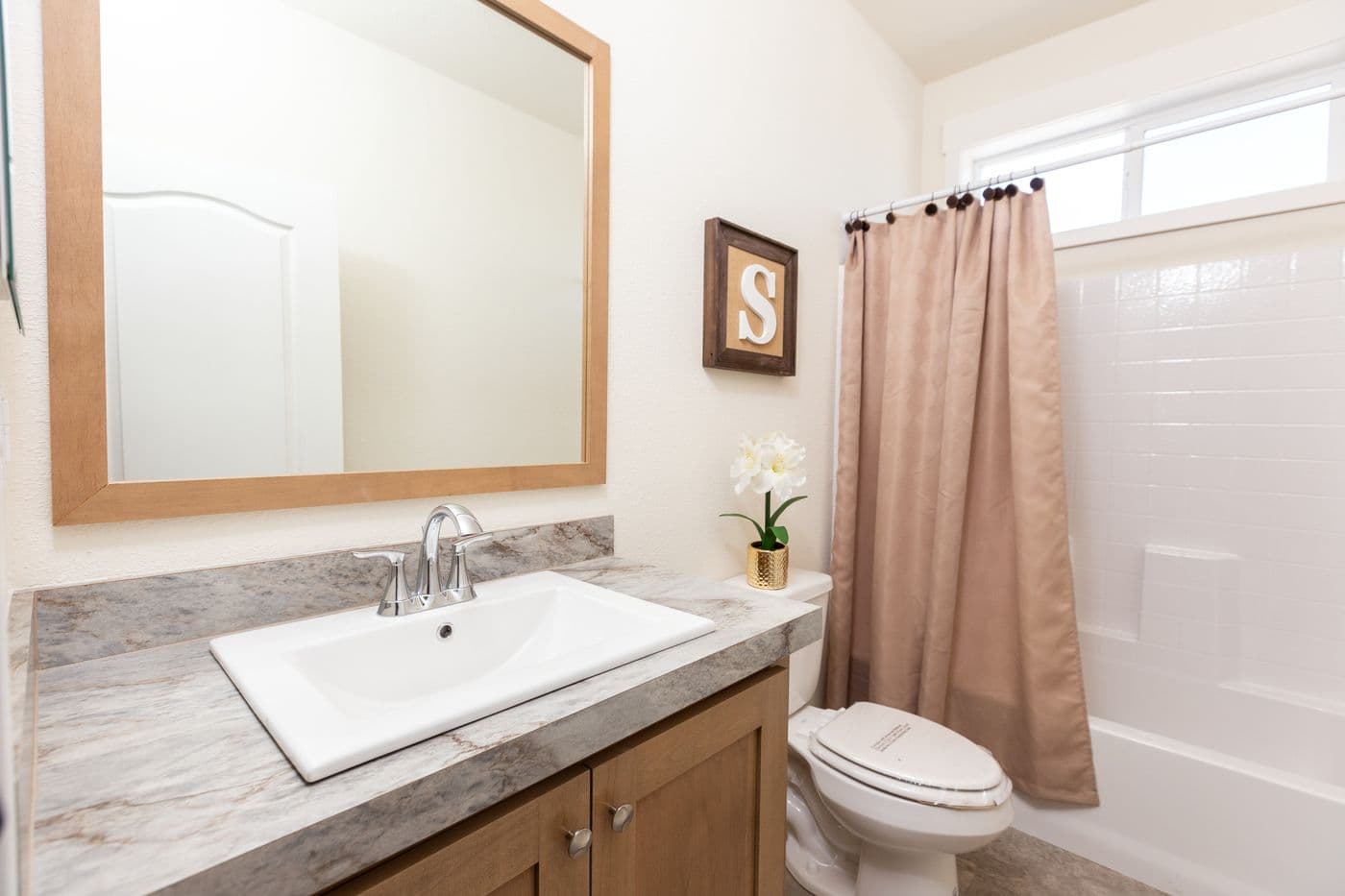 The CORONADO 2452B Guest Bathroom. This Manufactured Mobile Home features 3 bedrooms and 2 baths.
