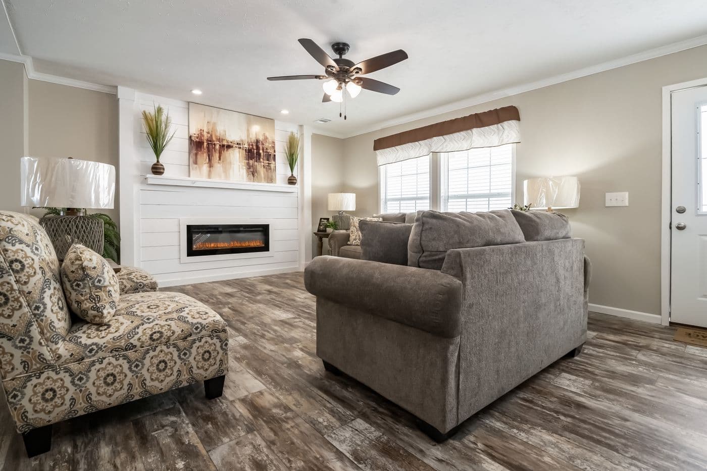 The THE JEFFERSON Living Room. This Manufactured Mobile Home features 3 bedrooms and 3 baths.