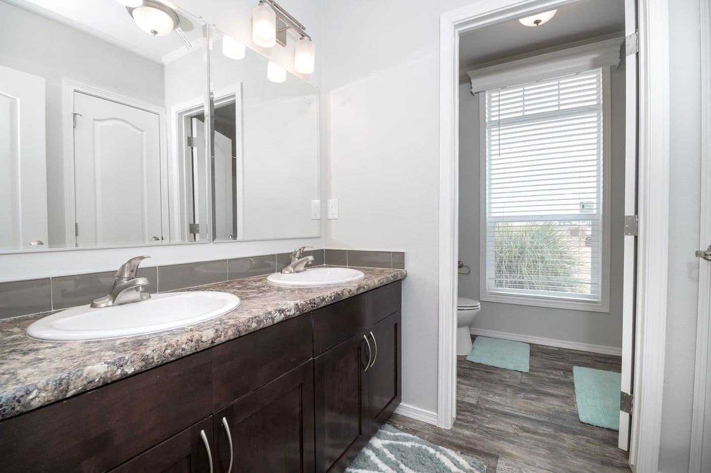 The ENCHANTMENT 3070A Primary Bathroom. This Manufactured Mobile Home features 3 bedrooms and 2 baths.