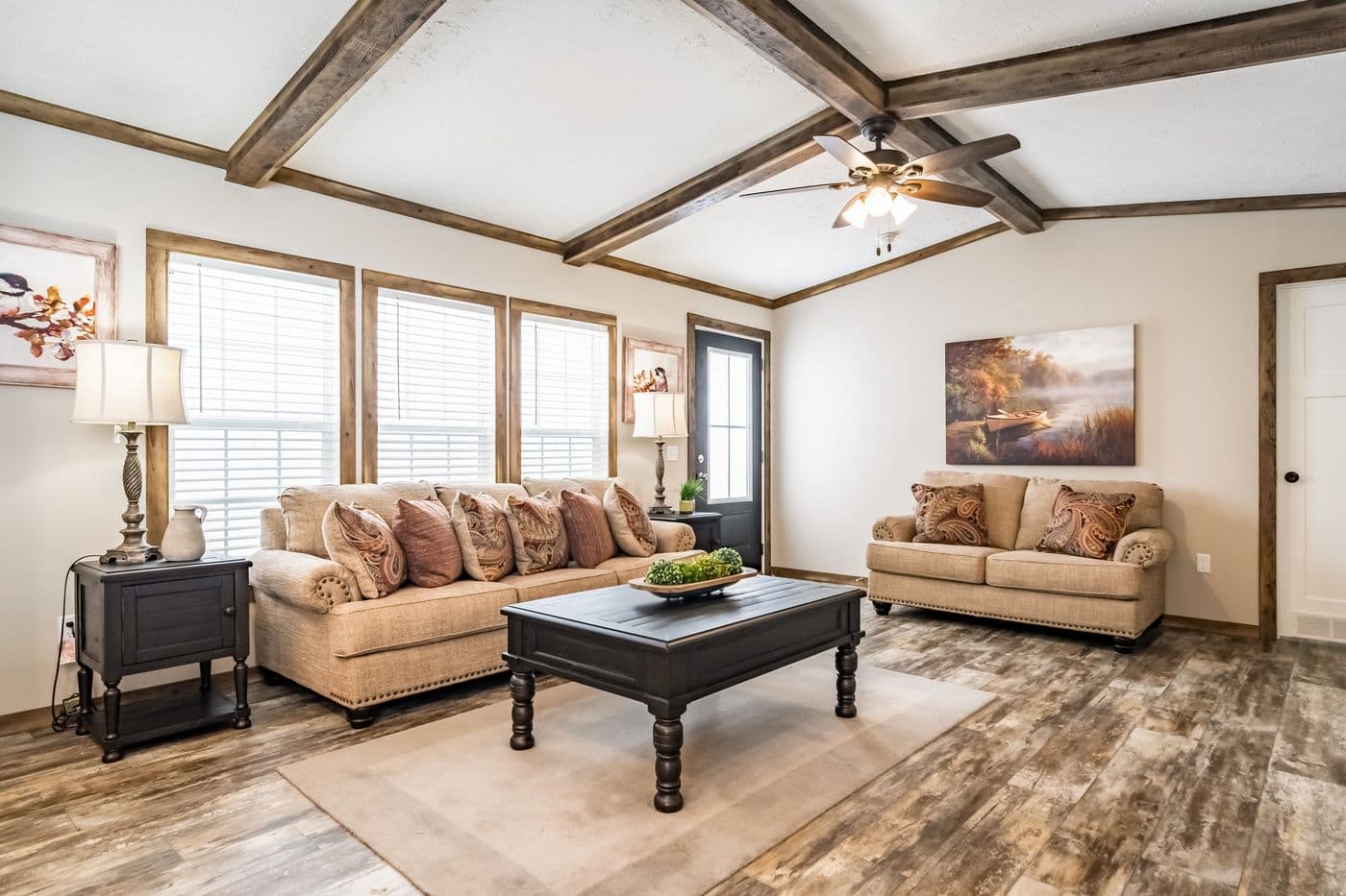 The THE BOBBY JO Living Room. This Manufactured Mobile Home features 3 bedrooms and 2 baths.