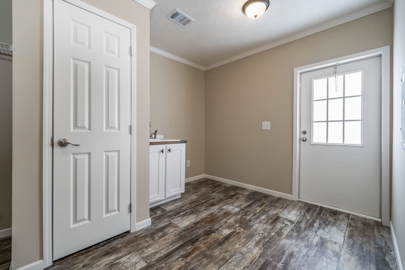 The THE JEFFERSON Utility Room. This Manufactured Mobile Home features 3 bedrooms and 3 baths.
