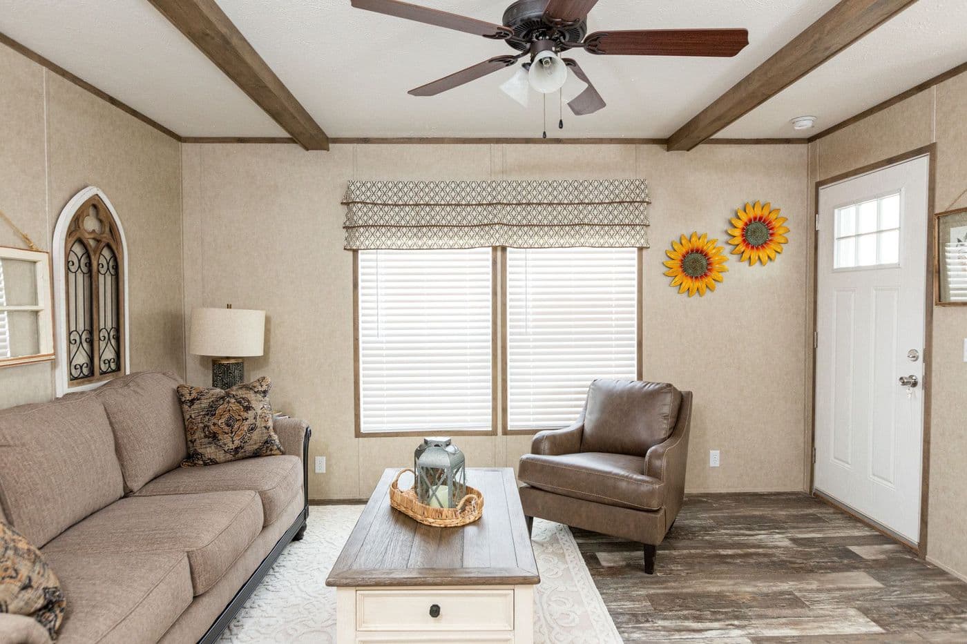 The THE RANCH HOUSE Living Room. This Manufactured Mobile Home features 3 bedrooms and 2 baths.