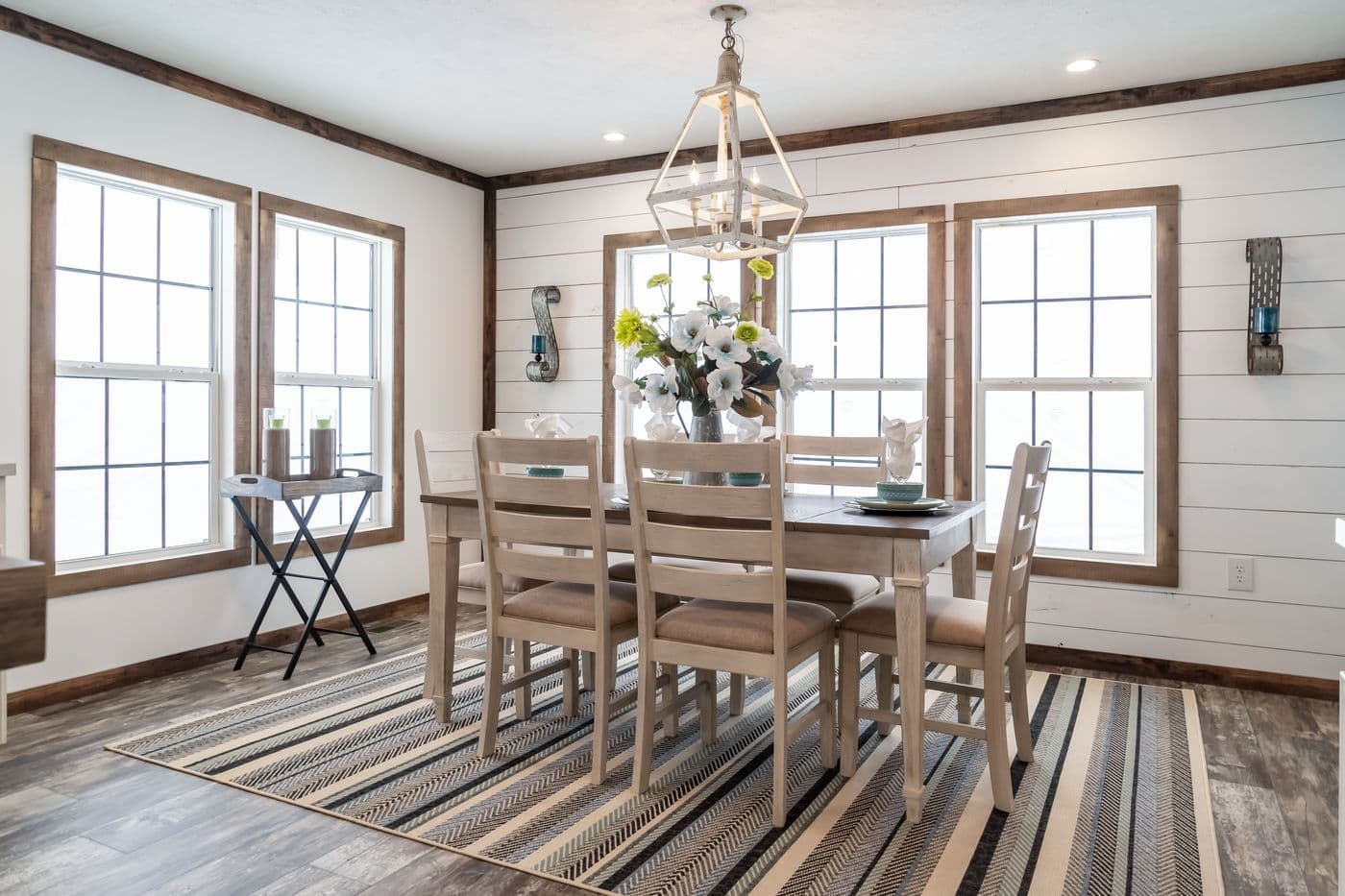 The THE EMMA JEAN Dining Room. This Manufactured Mobile Home features 4 bedrooms and 3 baths.
