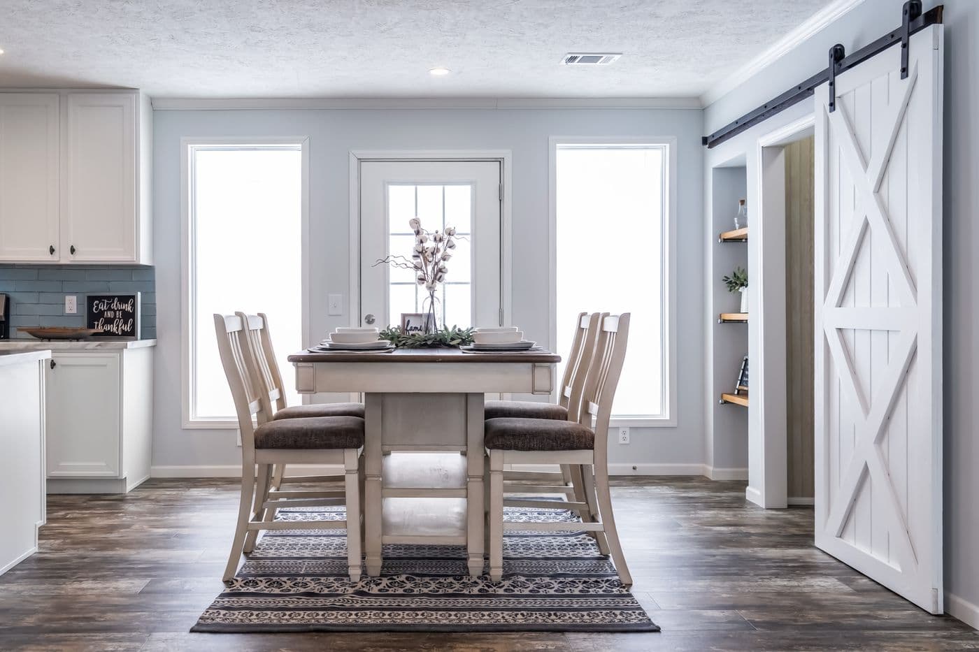 The THE LEAHY Dining Area. This Manufactured Mobile Home features 4 bedrooms and 2 baths.