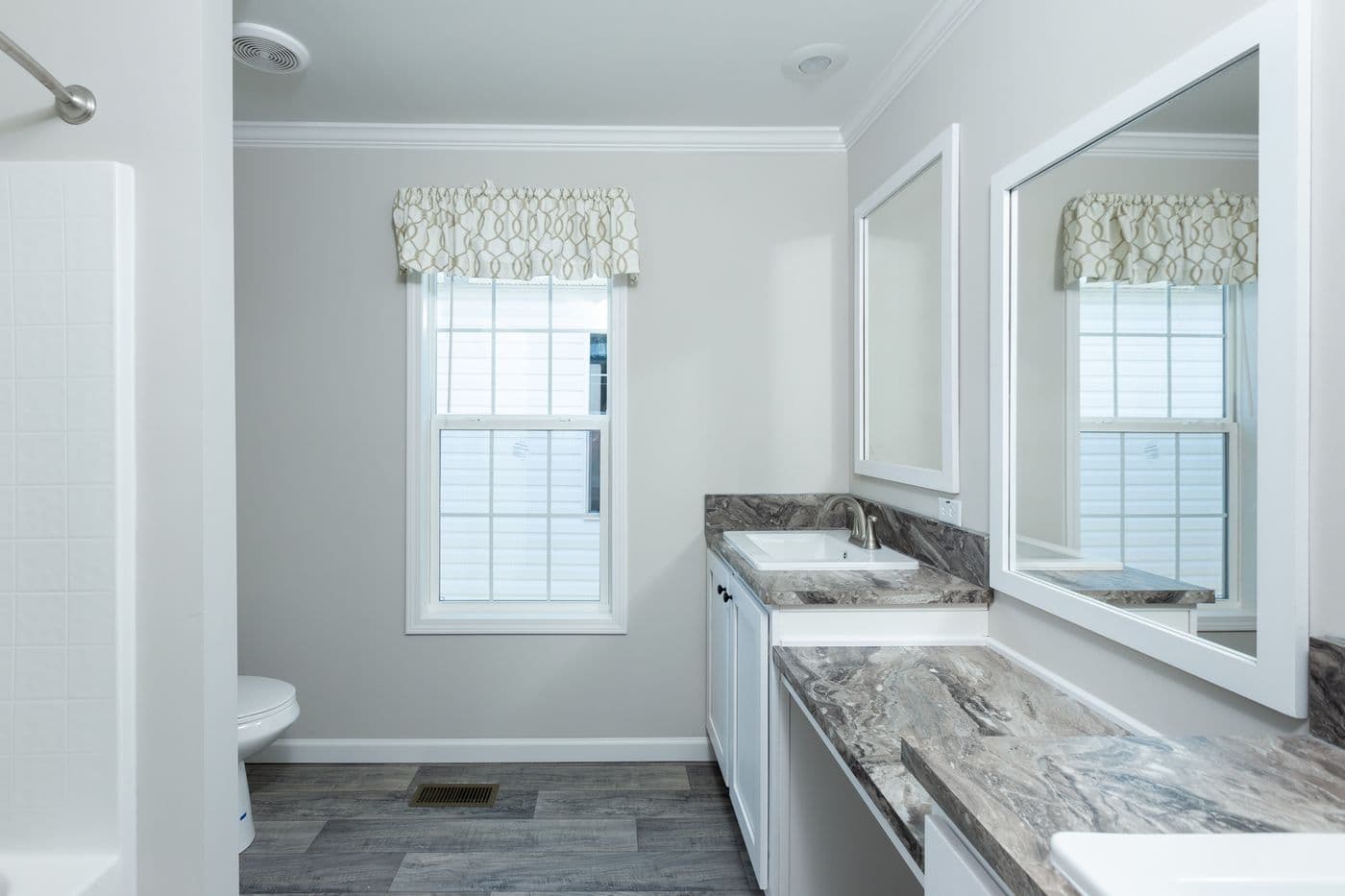 The THE FREEDOM BREEZE Guest Bathroom. This Manufactured Mobile Home features 3 bedrooms and 2 baths.