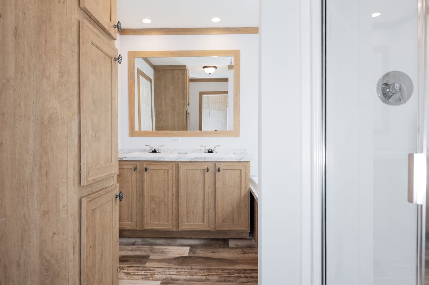 The THE BEXAR Primary Bathroom. This Manufactured Mobile Home features 3 bedrooms and 2 baths.