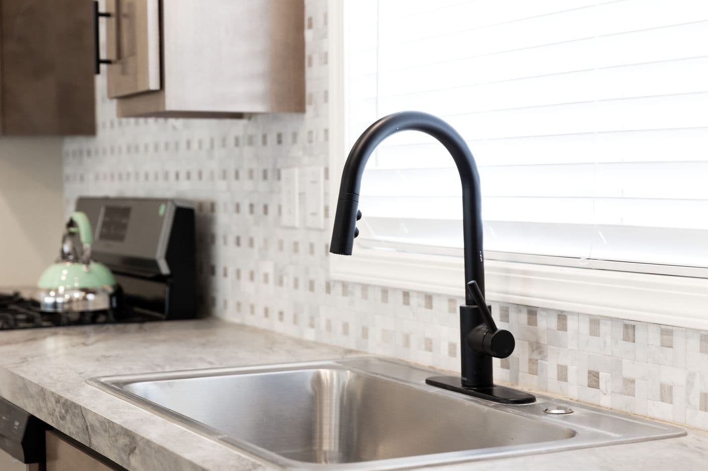 The CORONADO 2462A Kitchen. This Manufactured Mobile Home features 3 bedrooms and 2 baths.