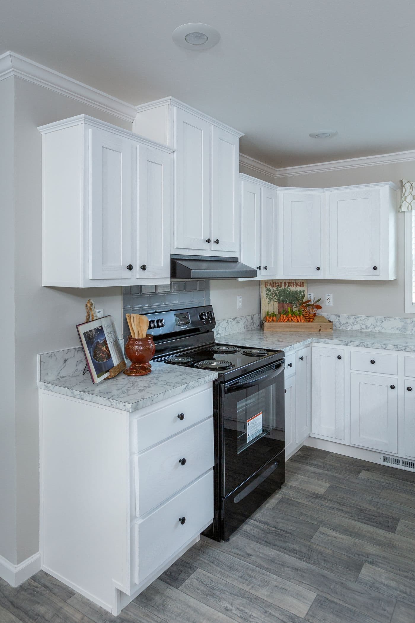 The THE FREEDOM BREEZE Kitchen. This Manufactured Mobile Home features 3 bedrooms and 2 baths.