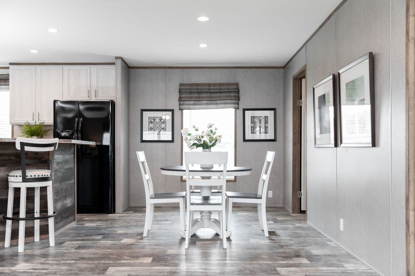 The THE MORRIS Dining Area. This Manufactured Mobile Home features 3 bedrooms and 2 baths.