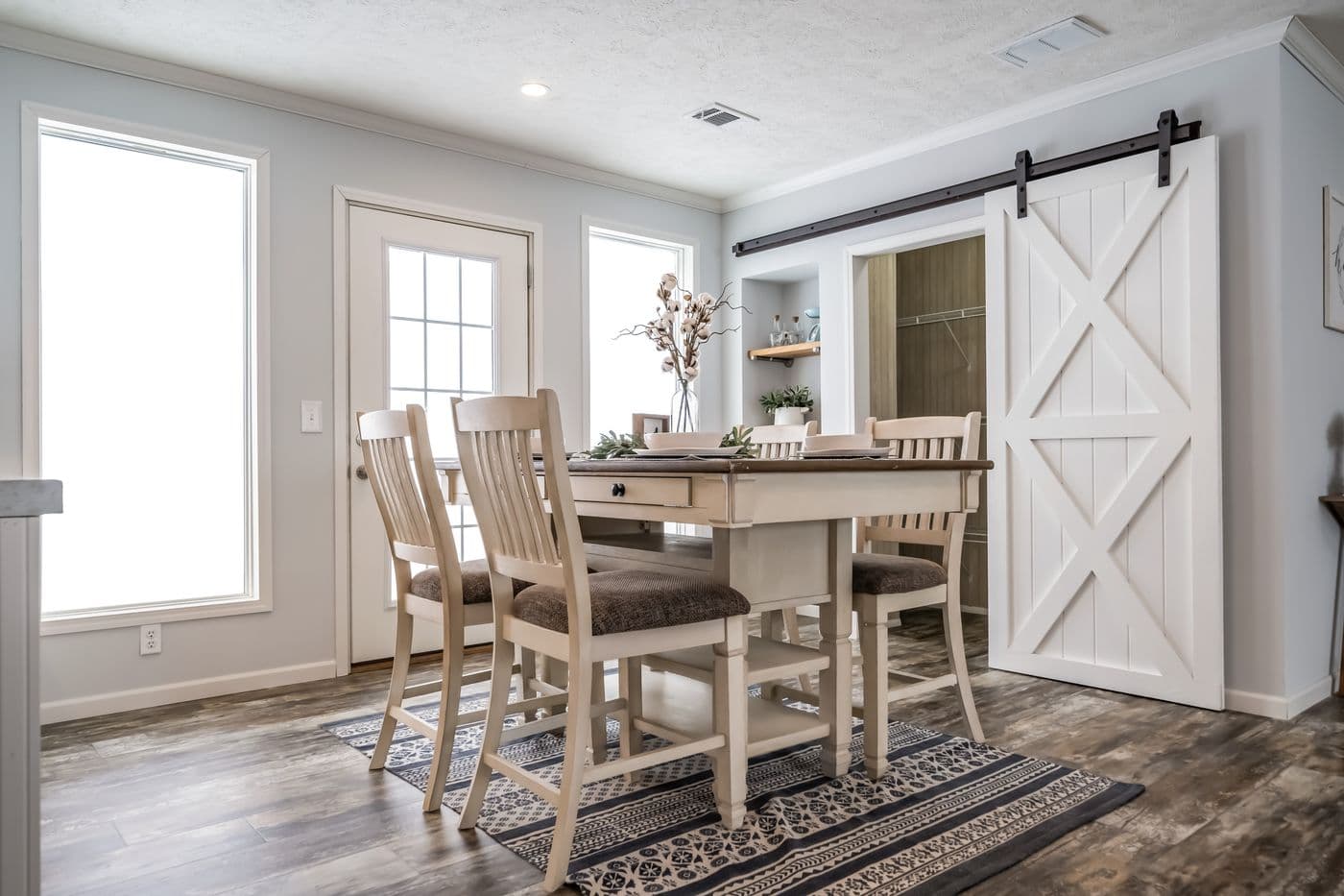 The THE LEAHY Dining Area. This Manufactured Mobile Home features 4 bedrooms and 2 baths.