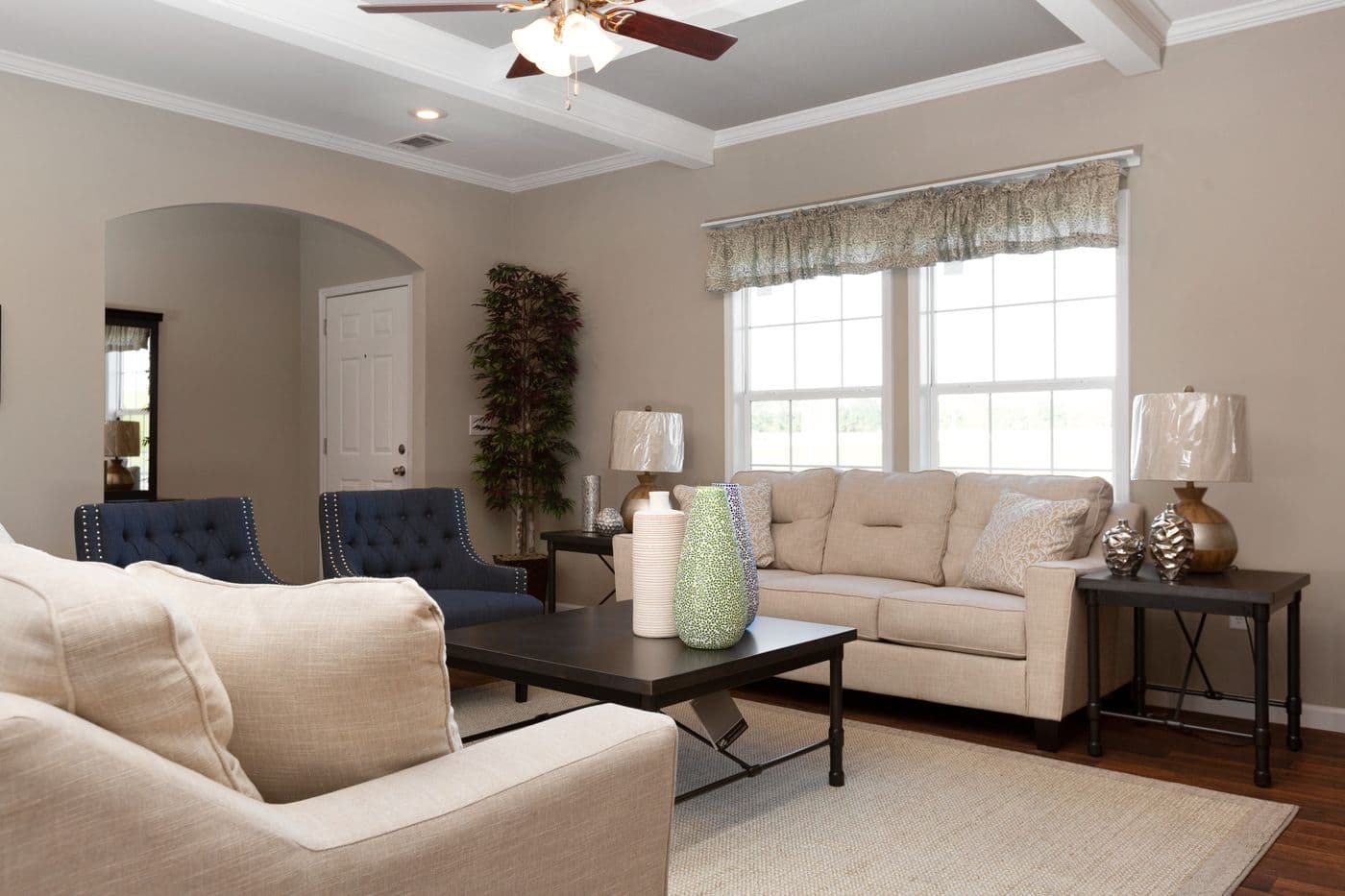 The NORMANDY Living Room. This Manufactured Mobile Home features 3 bedrooms and 2 baths.
